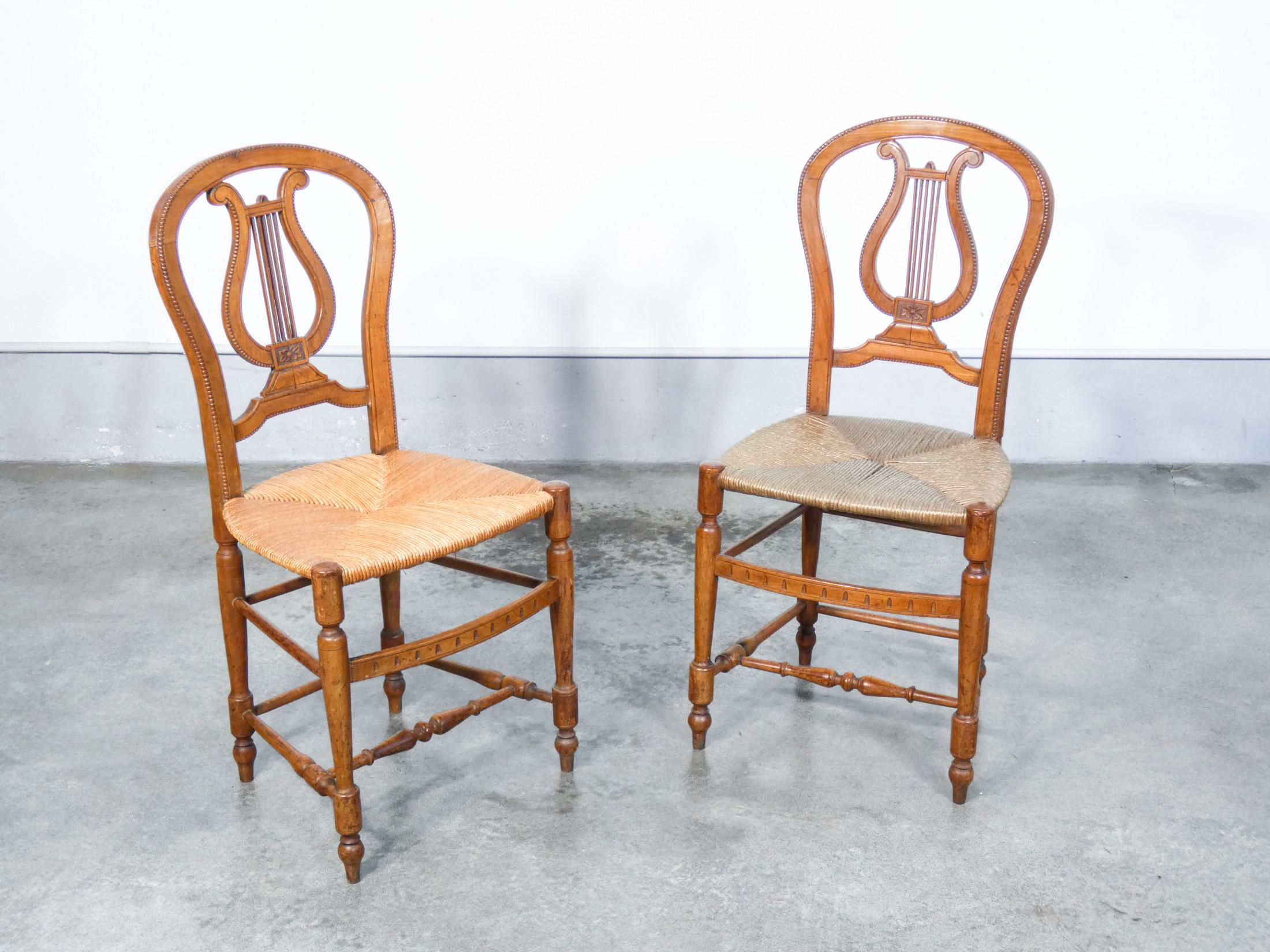 Pair of cherry wood chairs with lyre-shaped back and straw seat

Origin
Italy

Period
Very early twentieth century

Materials
Solid carved cherry wood. Straw seats

Dimensions
Height: 91.5 cm
Width: 44 cm
Depth: 45.5 cm
Seat: 45