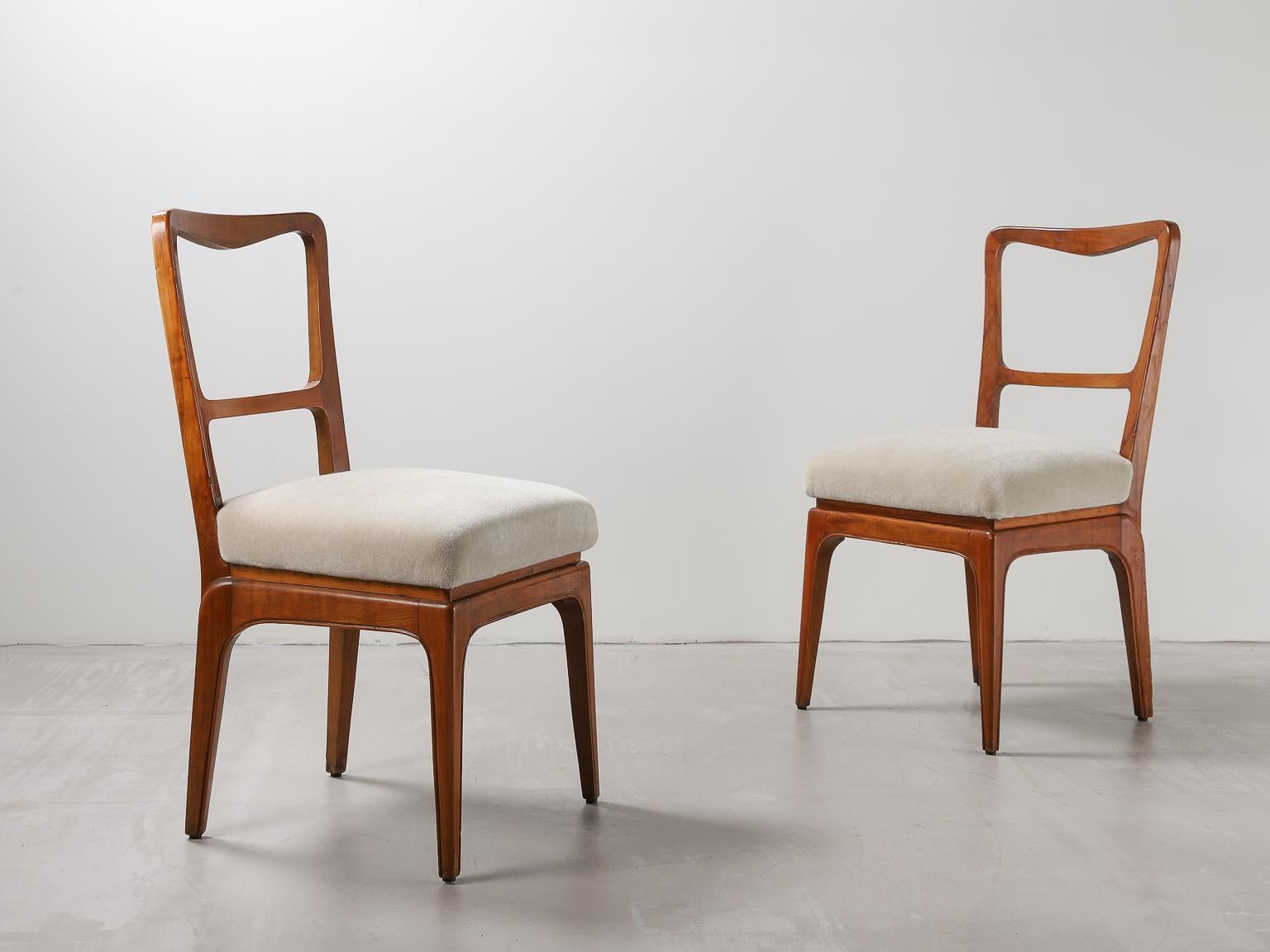 Pair of chairs designed by Paolo Buffa in a warm cherrywood, re-upholstered in bespoke mohair fabric by Thurstan.

Paolo Buffa (1903-1970) was born in Milan before going to study architecture at Politecnico, graduating in 1927. In addition to