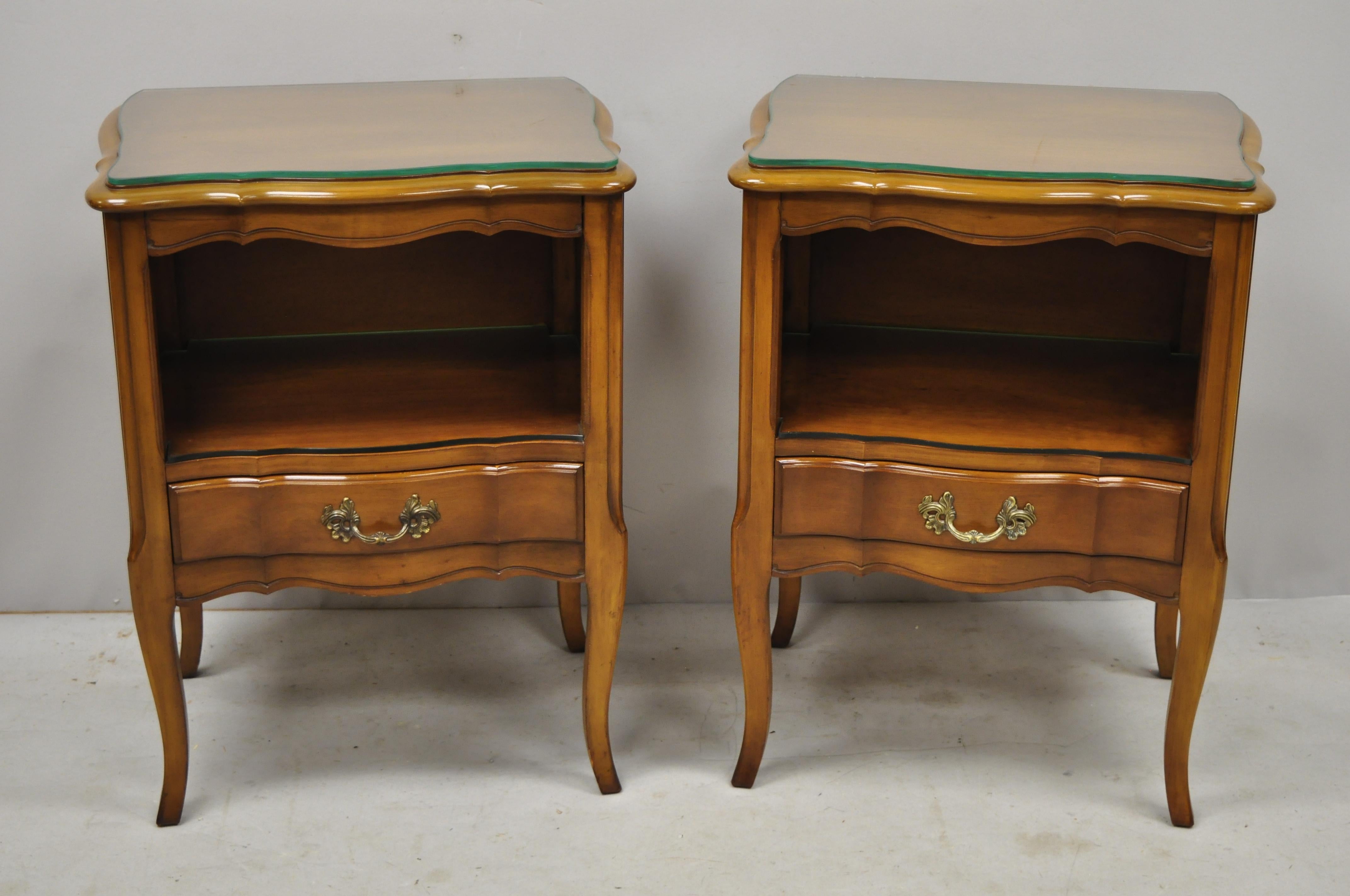 Pair of vintage cherrywood French Provincial nightstand bedside tables by White Furniture. Listing includes custom glass to the interior shelf and top, solid wood construction, beautiful wood grain, original stamp, 1 dovetailed drawer, cabriole
