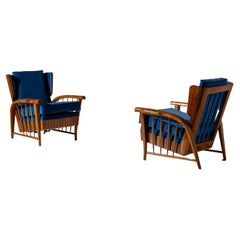 Pair of cherrywood lounge chairs, Italy, 1950s