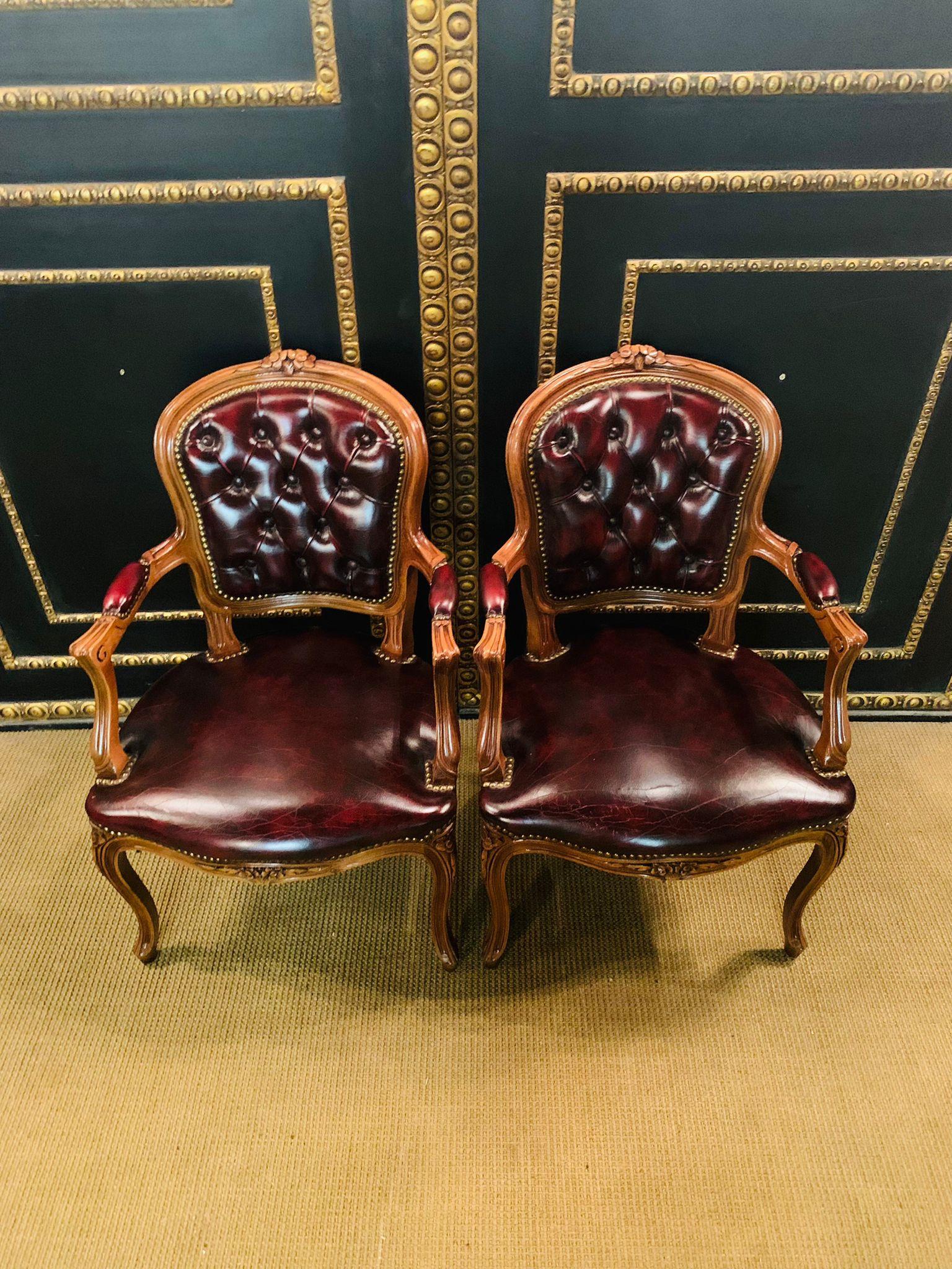 We are delighted to offer you this stunning pair of Chesterfield carver armchairs in oxblood leather with hand carved frames. The chairs are a lovely find and in original condition throughout, both are buttoned and look glorious from every angle