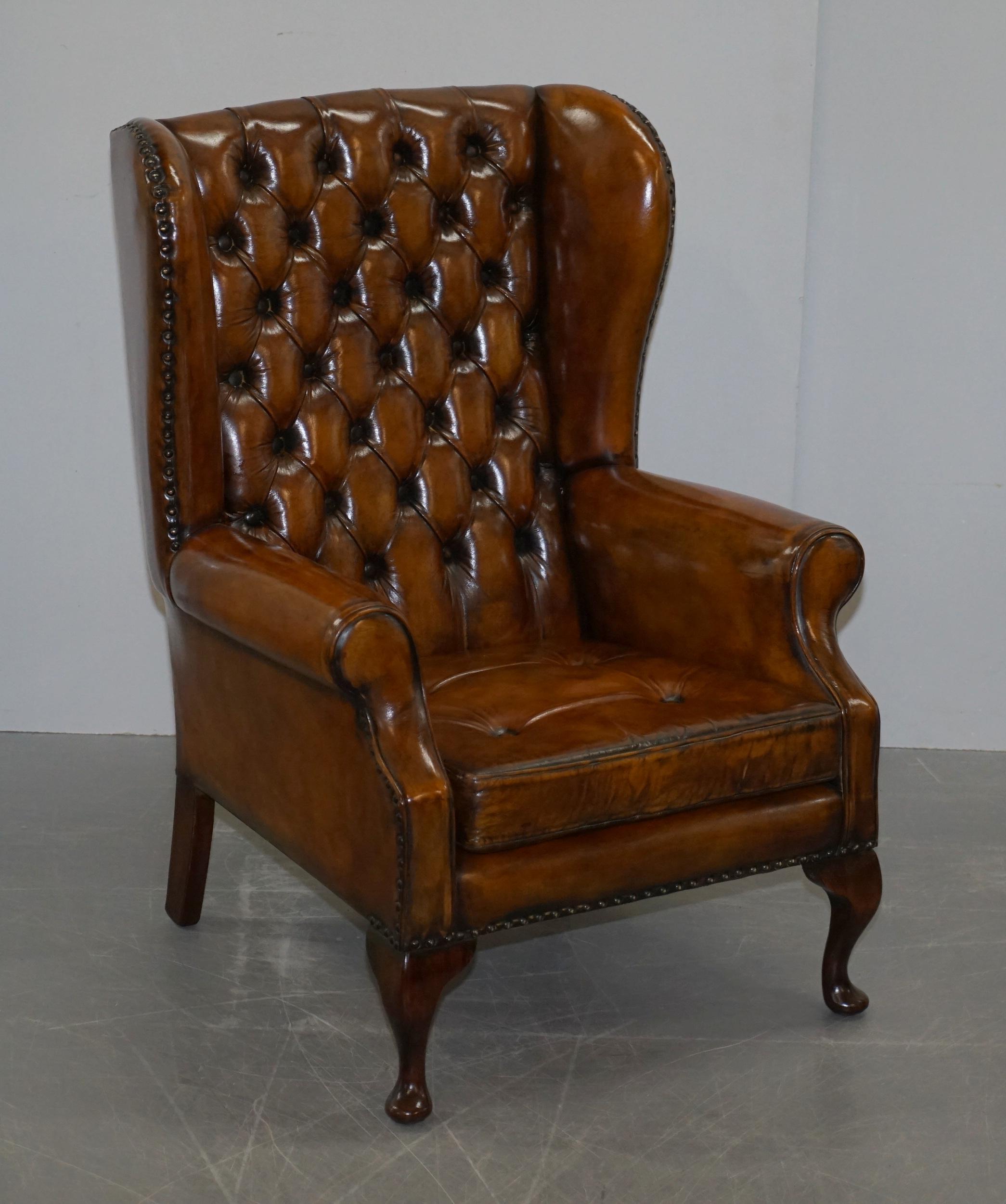 We are delighted to offer for sale this stunning pair of Thomas Chippendale style Chesterfield fully restored vintage wingback armchairs in Whisky brown leather with floating button cushions 

A good looking and comfortable pair vintage English