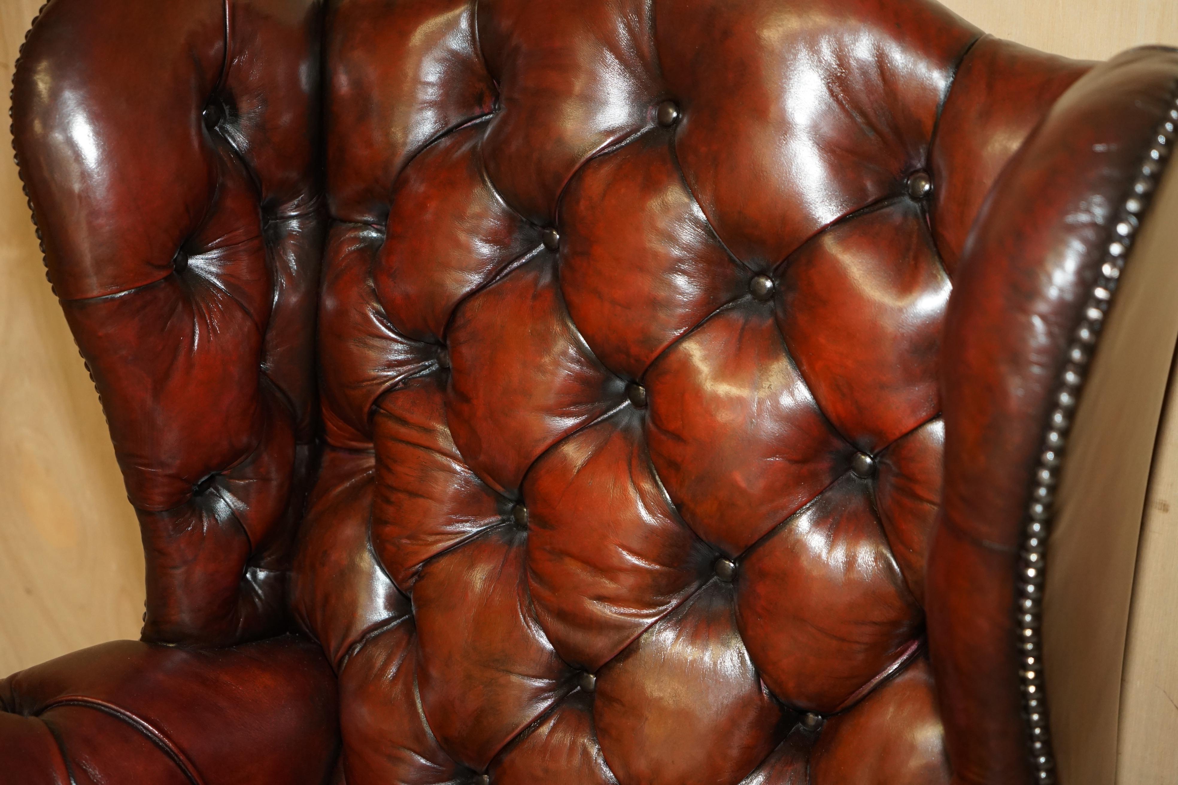 Hand-Crafted PAIR OF CHESTERFIELD VINTAGE OXBLOOD LEATHER WINGBACK ARMCHAIRS & FOOTSTOOLs For Sale