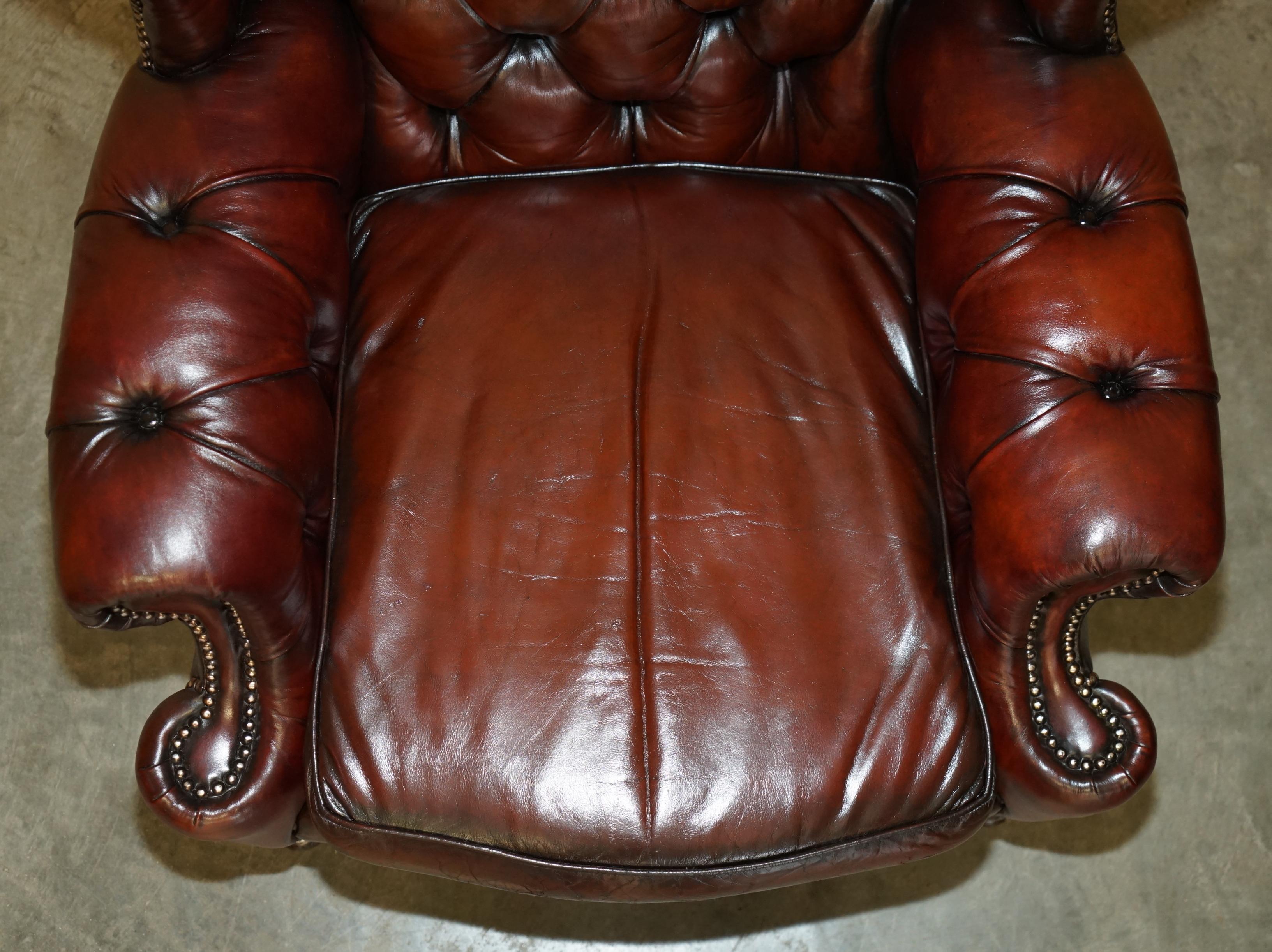 20th Century PAIR OF CHESTERFIELD VINTAGE OXBLOOD LEATHER WINGBACK ARMCHAIRS & FOOTSTOOLs For Sale