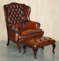 PAIR OF CHESTERFIELD WILLIAM MORRIS BROWN LEATHER WiNGBACK ARMCHAIRS FOOTSTOOLS