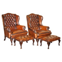 PAIR OF CHESTERFIELD WILLIAM MORRIS BROWN LEATHER WiNGBACK ARMCHAIRS FOOTSTOOLS