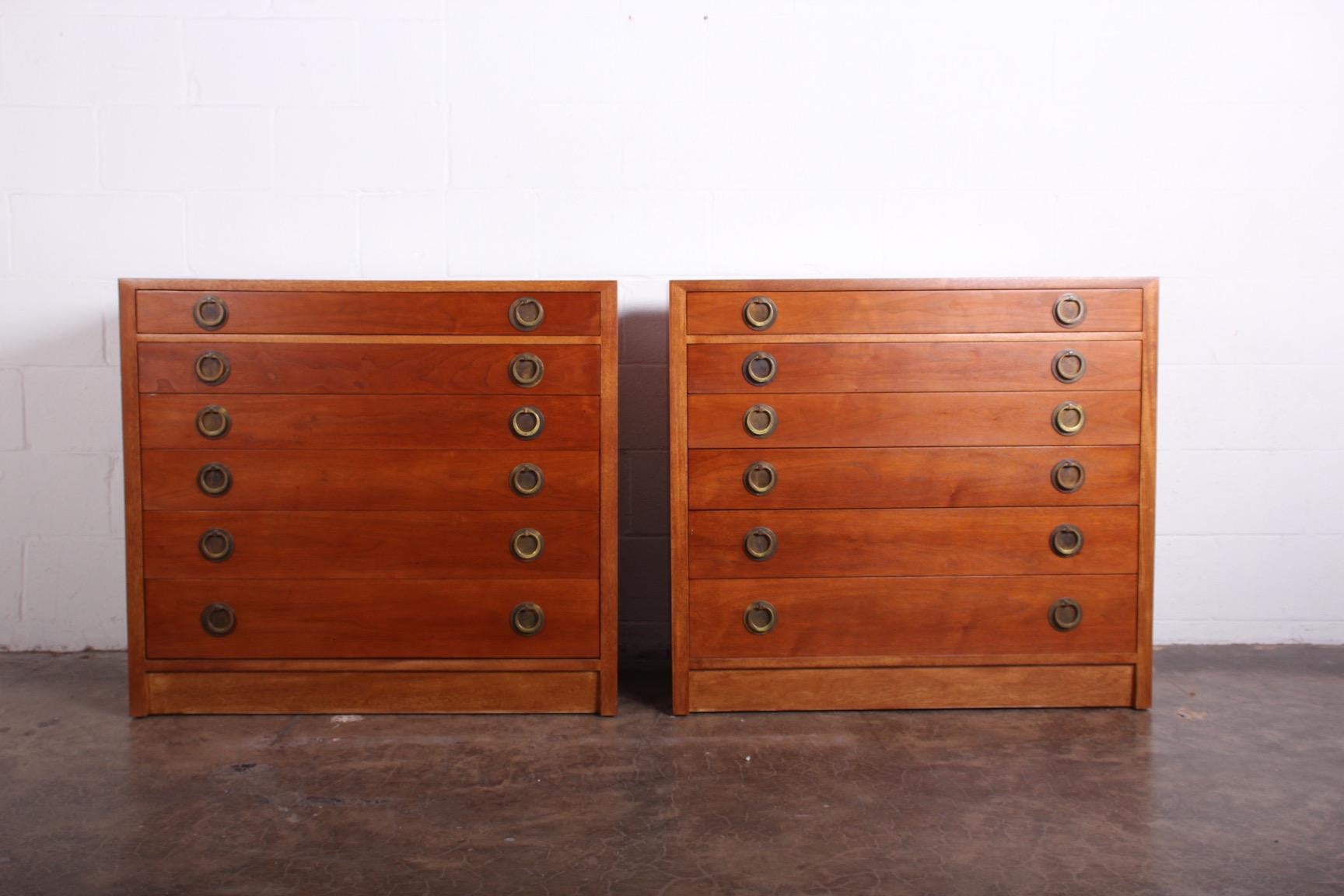 A pair of two tone dressers with brass hardware. Designed by Edward Wormley for Dunbar.