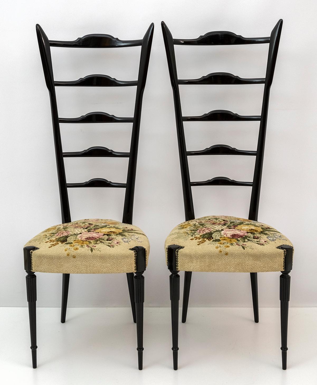 Pair of fantastic high-backed ladder chairs in walnut-stained beech with seats in the original fabric of the time. These amazing pieces were designed by Gio Ponti for Chiavari in the 1950's in Italy.