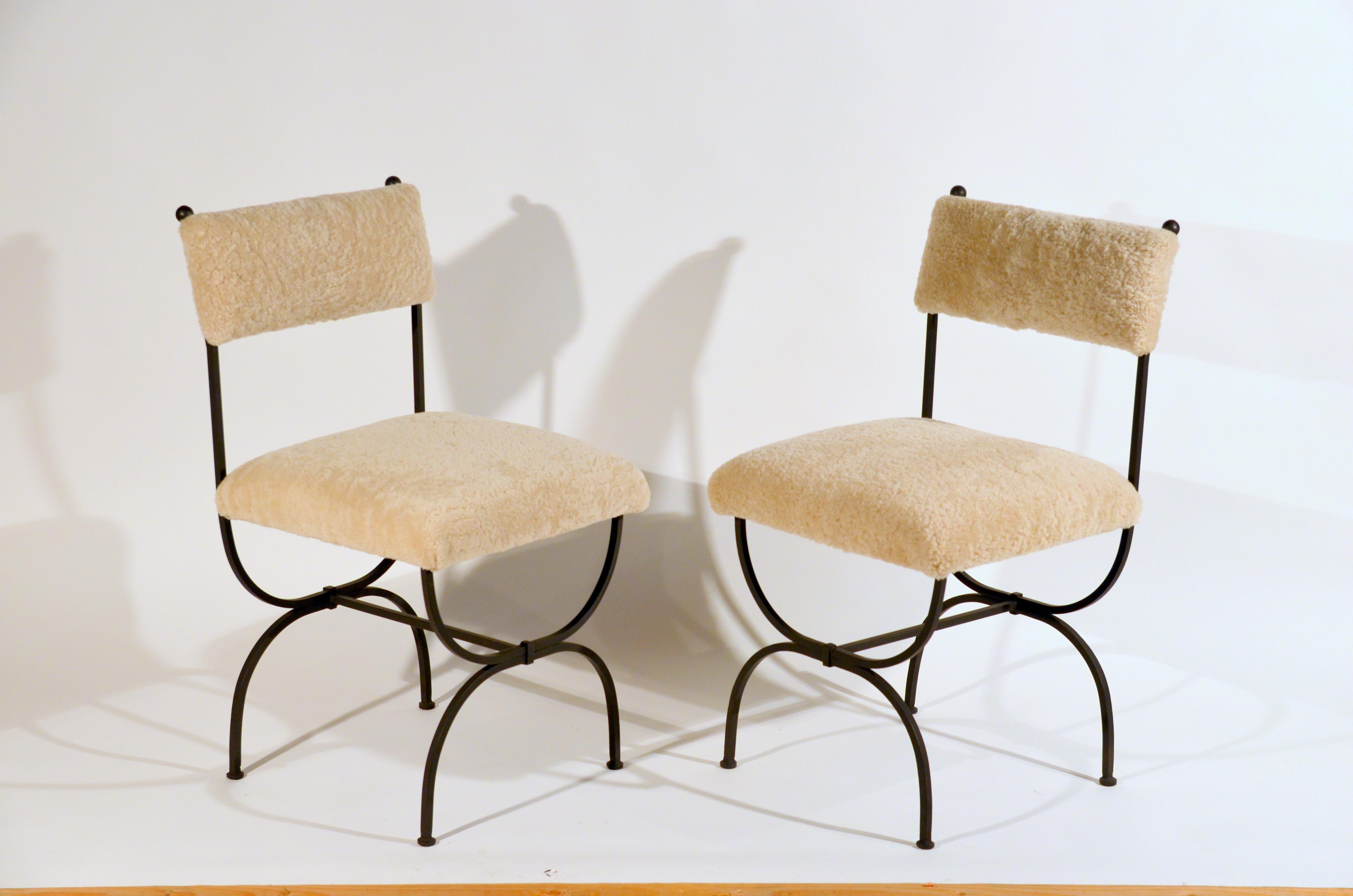 Pair of chic 'Arcade' wrought iron and shearling chairs by Design Frères.

Extraordinary pair of side chairs with white shearling upholstery. This unique upholstery treatment gives these chairs a very luxurious feel. The beautifully proportioned