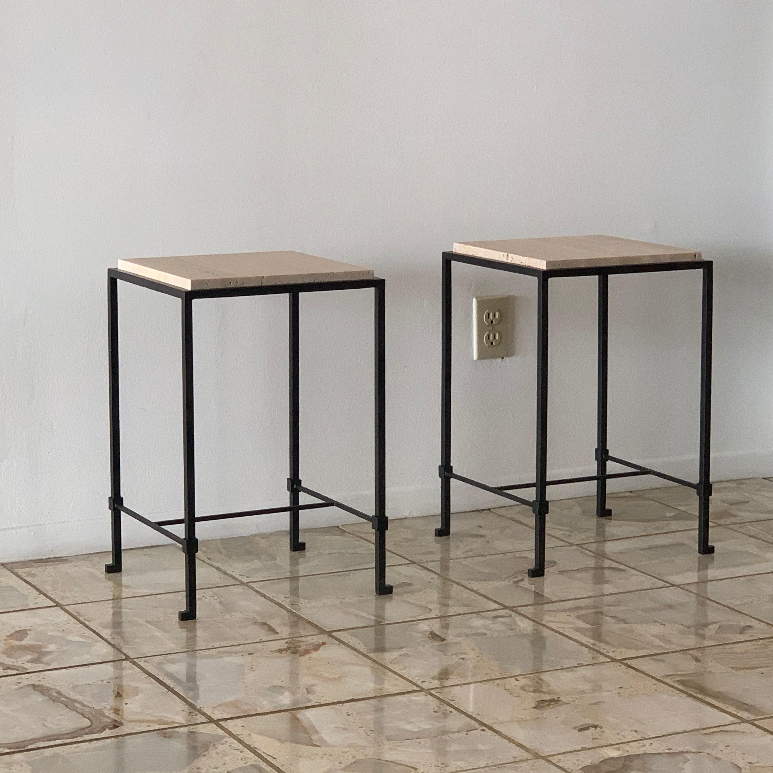 Pair of chic 'Diagramme' travertine drinks tables by Design Frères.

Slender powder-coated frames fitted with unfilled Italian travertine top inserts.

Inspired by the timeless aesthetic of French modern design, these tables from our exclusive