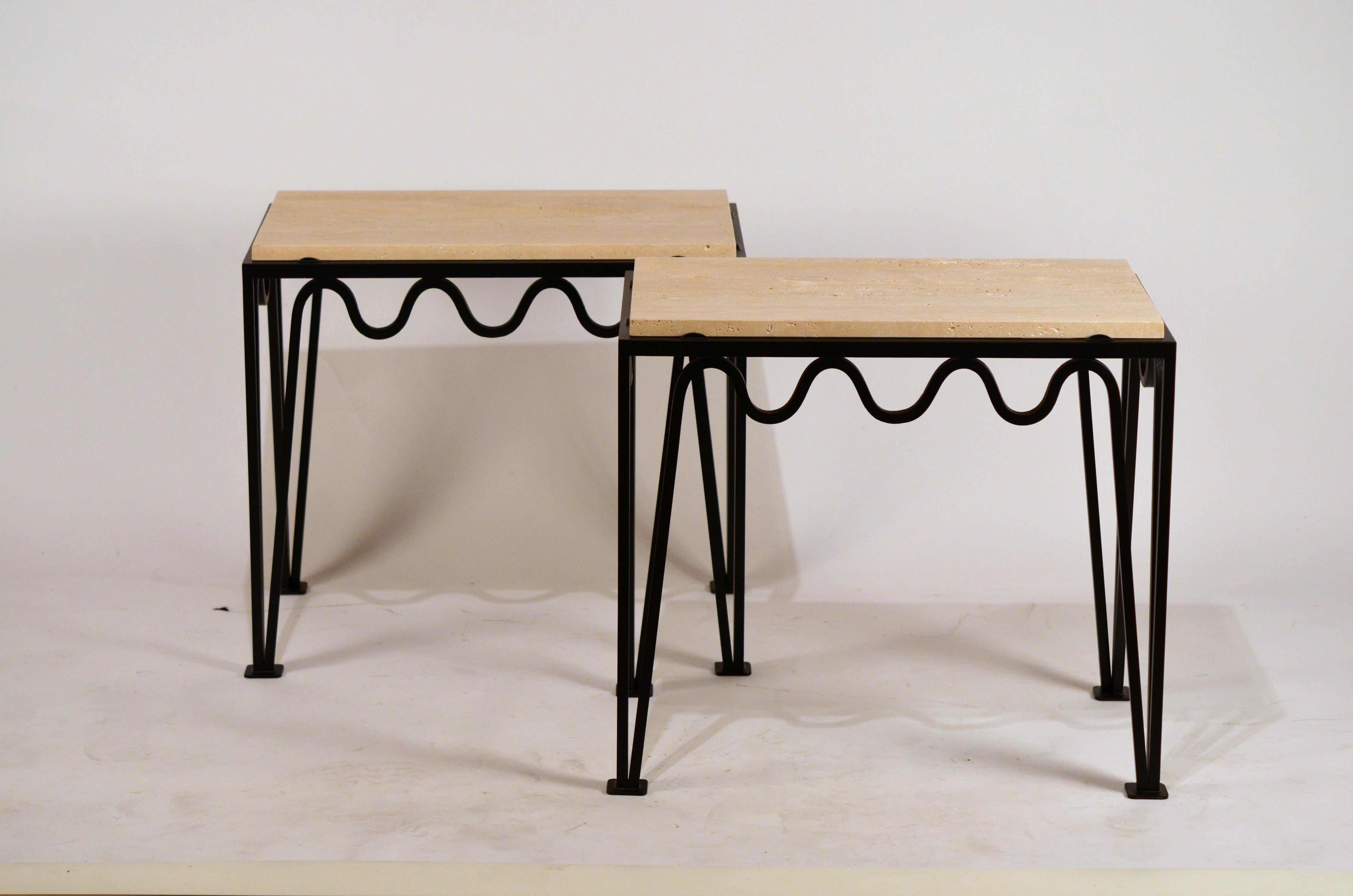 Pair of chic 'Méandre' black iron and travertine side tables by Design Frères®.

Elegant and understated.