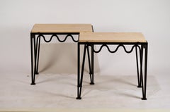 Pair of Chic 'Méandre' Black Iron and Travertine Side Tables by Design Frères