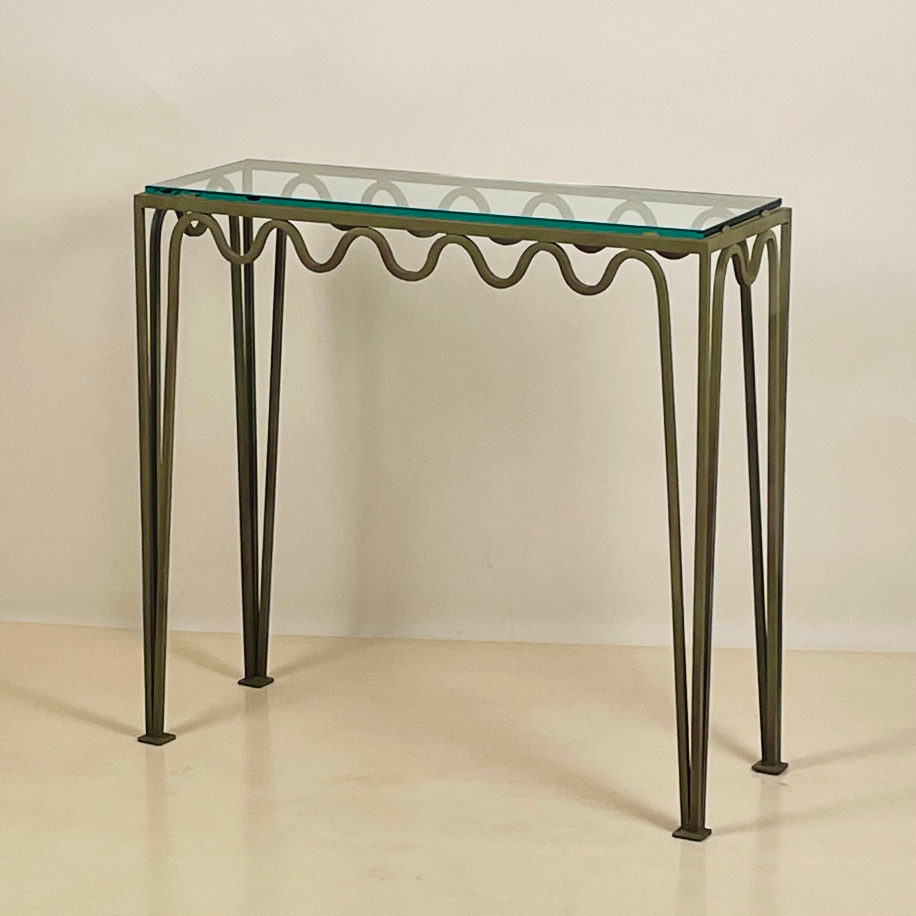 Pair of chic verdigris 'Meandre' and glass consoles by Design Frères.