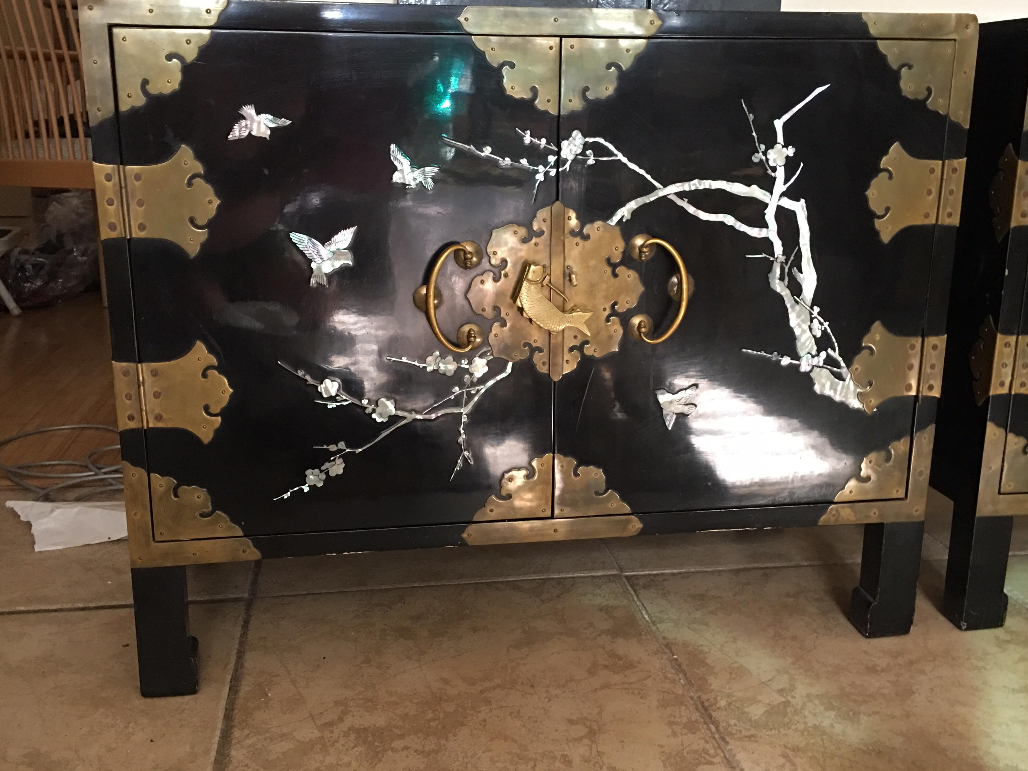 These very chic Chinese black lacquer nightstands with mother of pearl and brass trim came from a vintage Palm Springs Estate. The gentleman had exquisite taste. The estate was full of beautiful furniture and art treasures. What makes these
