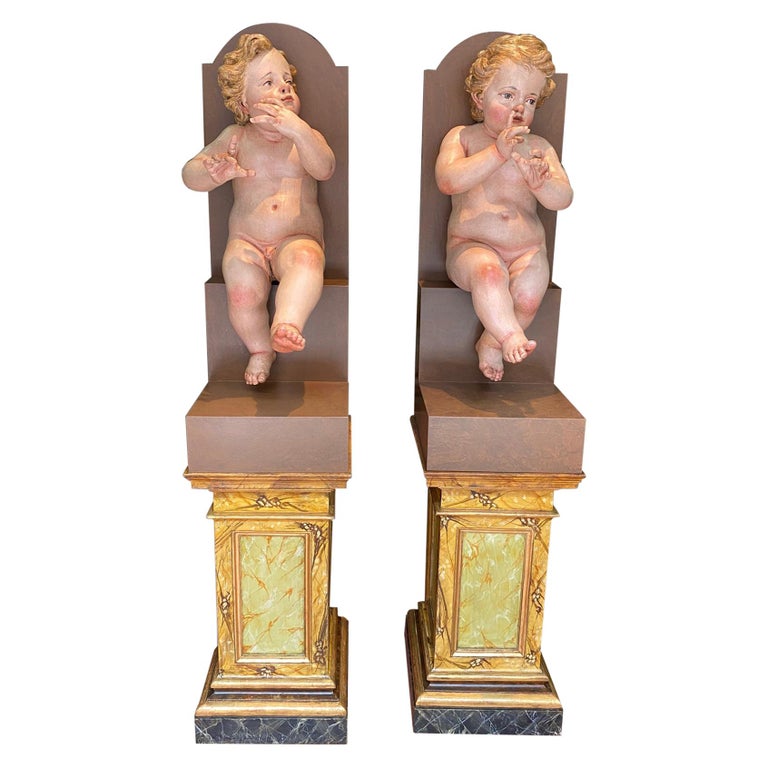Pair of pinewood children, 18th century, offered by Z. Sierra