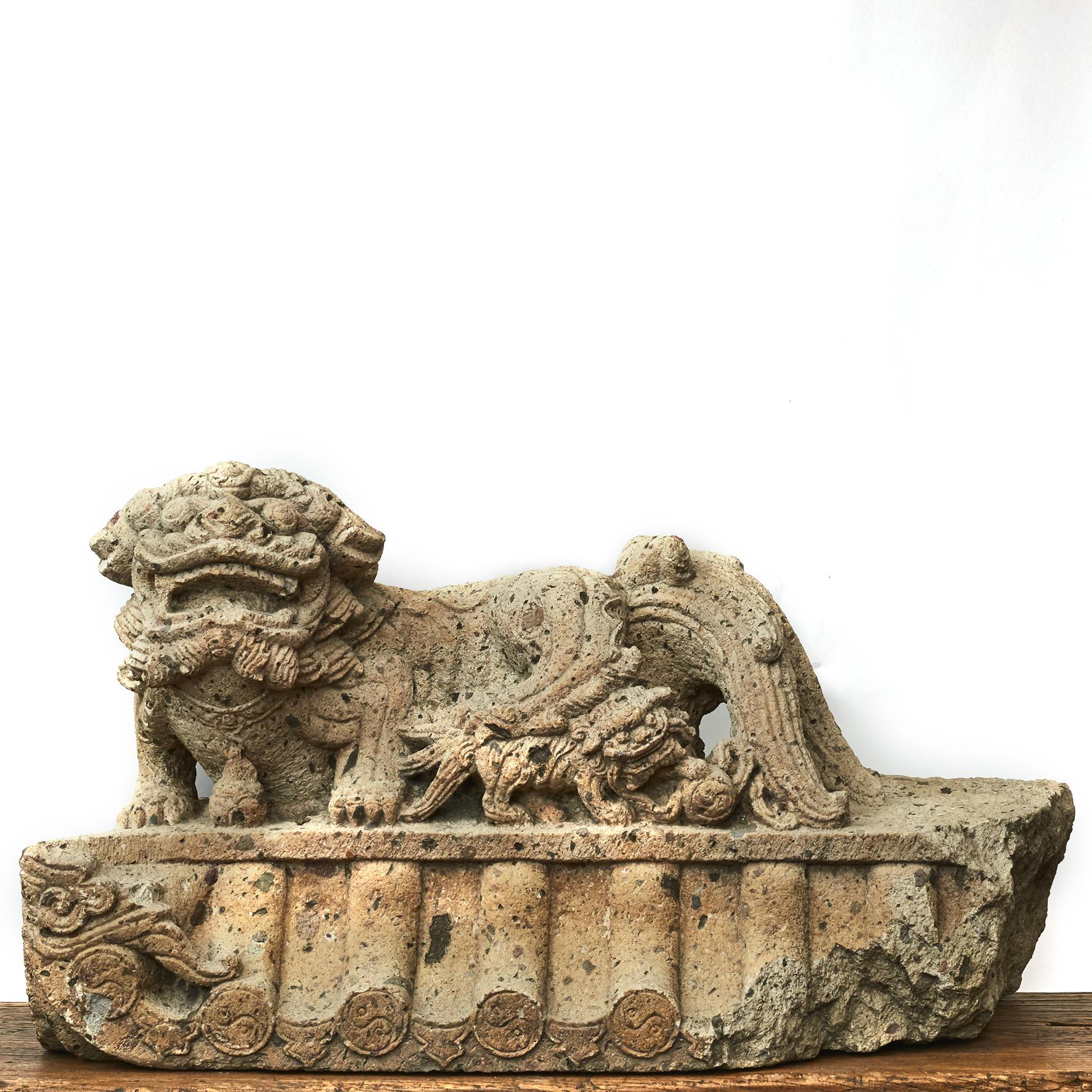 Pair of Chinese carved stone foo dog guardian lions from the 16-17th century. Very detailed.
The pair consist of a male leaning his paw upon an embroidered ball (in imperial contexts, representing supremacy over the world) and a female restraining