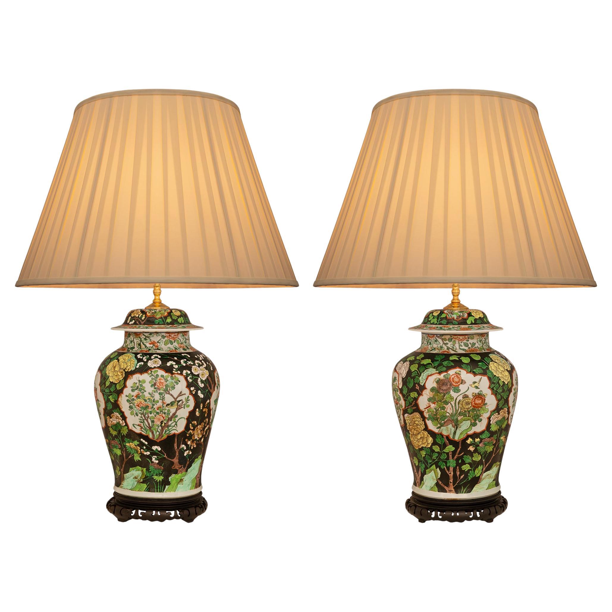 pair of Chinese 19th century Famille Verte Porcelain and patinated Wood lamps