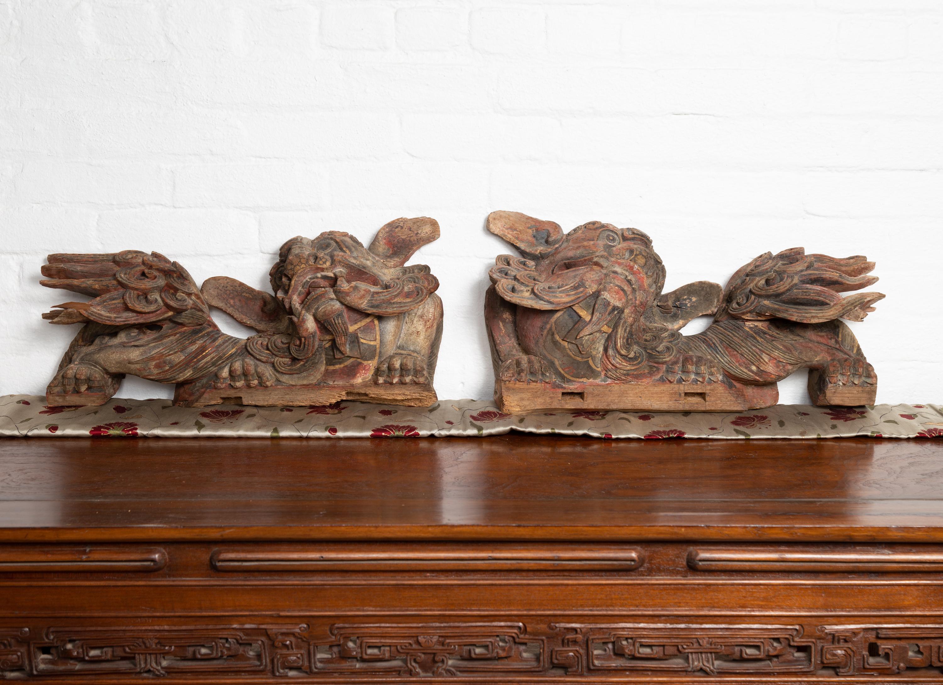 Hand-Carved Pair of Chinese 19th Century Hand Carved and Painted Temple Guardian Lions For Sale