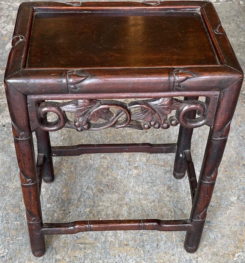 This is a pair of beautiful hand carved and stained set of nesting tables.