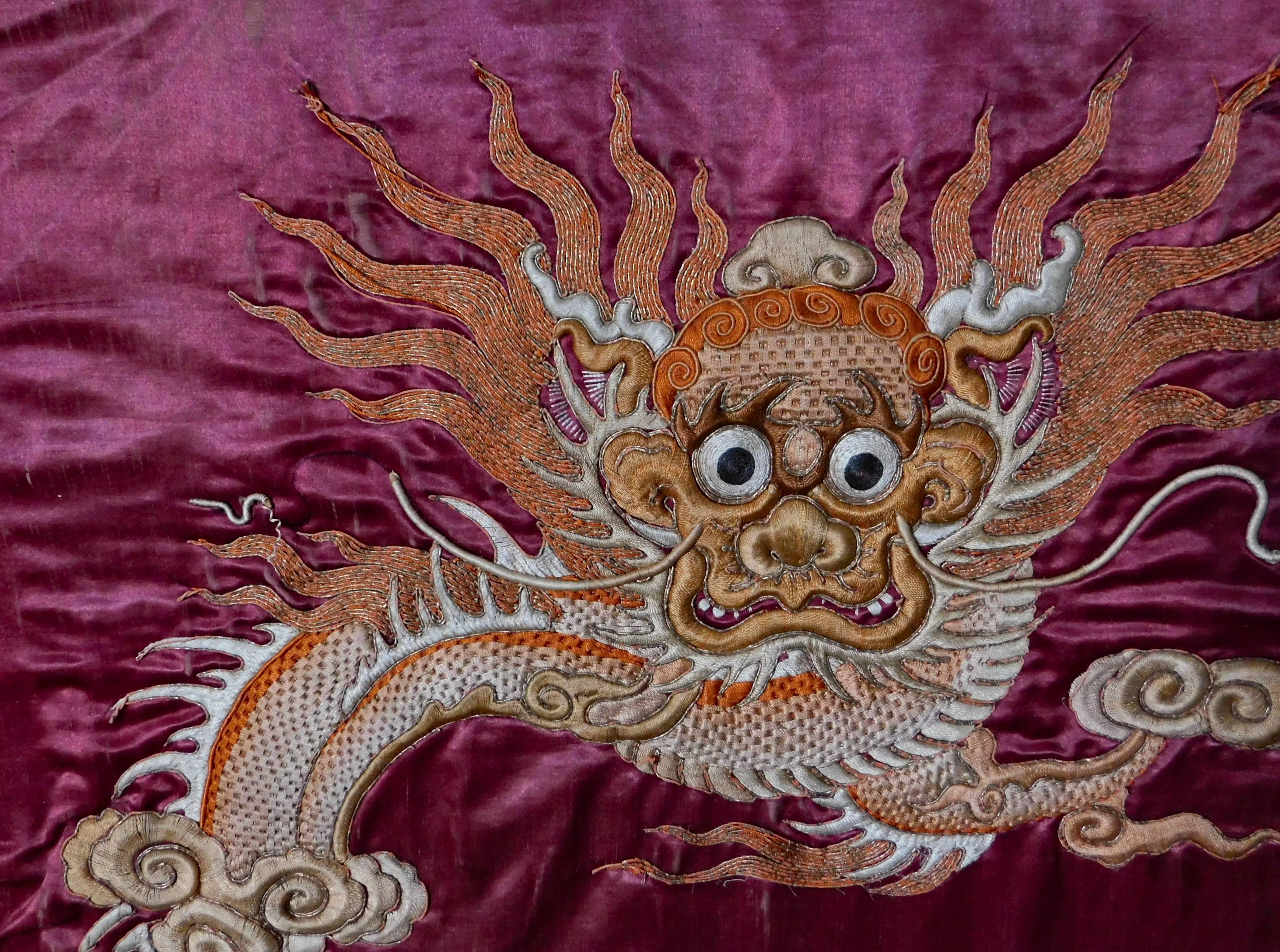 This stunning pair of Chinese silk panels are hand embroidered using the filled couching technique with silk and gold wrapped threads.
Especially beautiful are the stitches used to construct the dragon bodies which form a basket weave indented