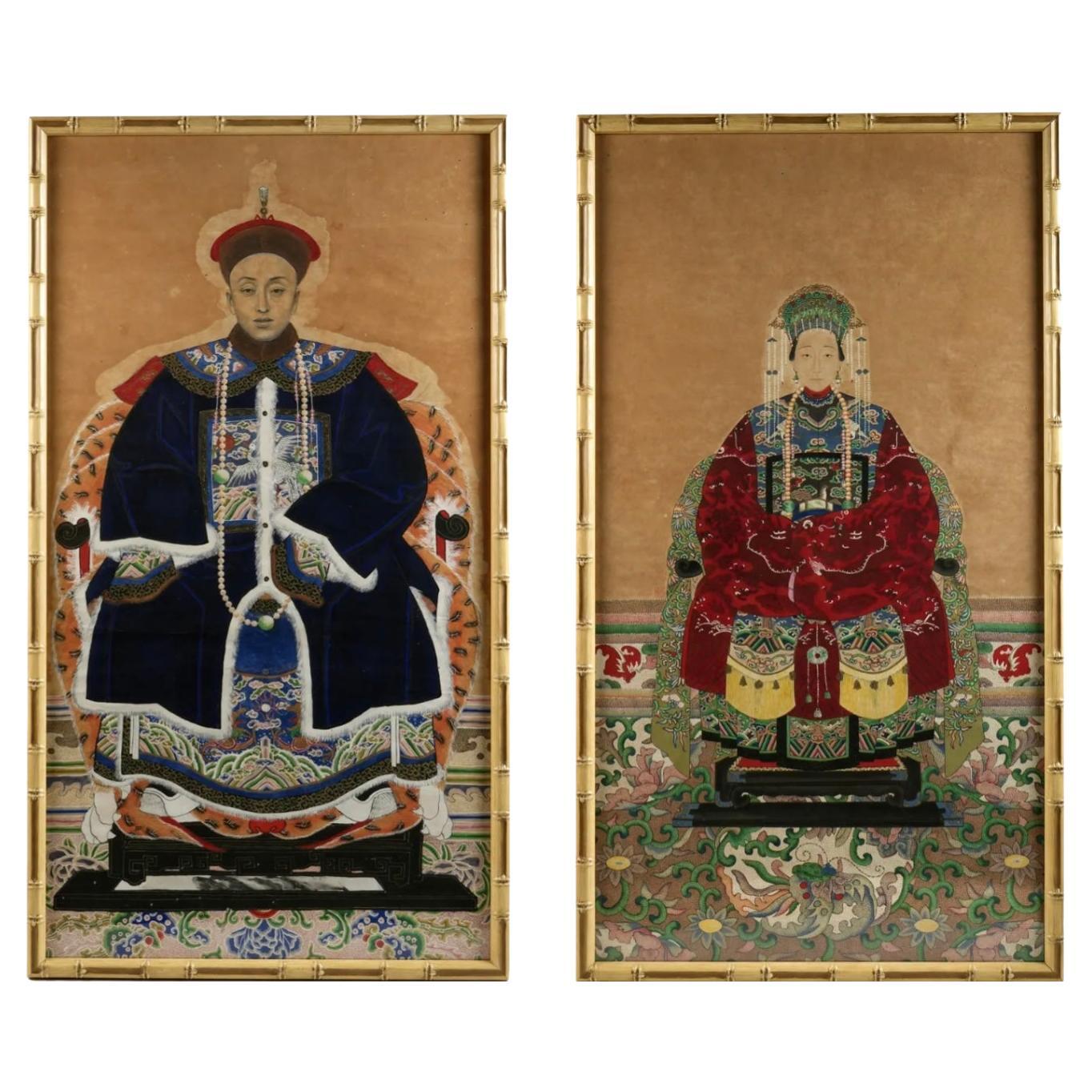 Pair Of Chinese Ancestral Portraits In Faux Bamboo Frames. Two pieces total, figures of seated man and woman ancestors, Watercolor/Gouache on Paper, unsigned. This pair of 19th-century hand paintings depicts a court official and a high-ranking woman