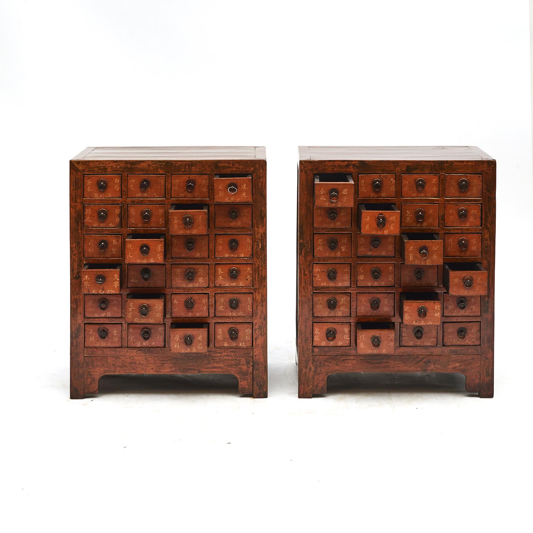 Pair of Chinese apothecary / pharmacy medicine chests, each having 24 drawers with Chinese script for, herbs, minerals and natural remedies.
Elm wood with original lacquer.
China mid-19th century.
Can be used as bedside tables
Sold as a pair.