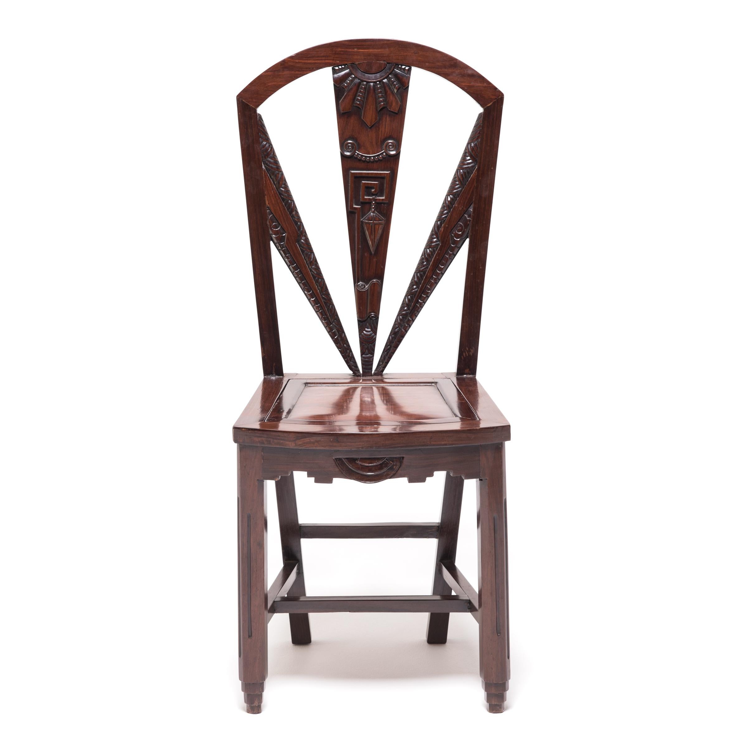 This pair of beautiful blackwood chairs was crafted a century ago in Shanghai, a bustling port city that was at the forefront of taste and influence in Chinese culture during the early 20th century. Made in the style of Art Deco, the striking,