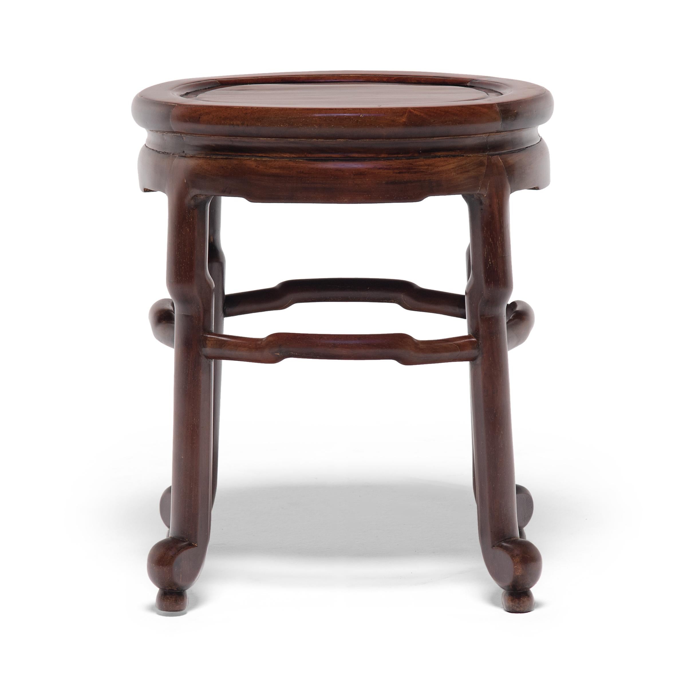 When the Art Deco movement reached major Chinese cities like Tianjin and Shanghai, the design aesthetic that emerged was the perfect intersection of European modernism and Ming-dynasty refinement. This oval stool is a product of the era, crafted in