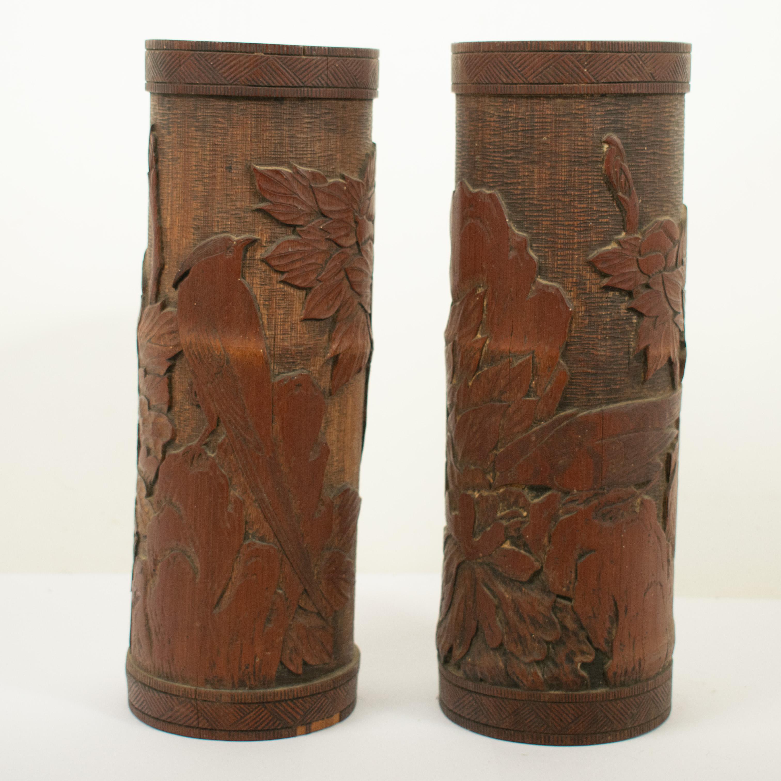 A pair of vintage Chinese bamboo brush pots. Skilfully carved with images of birds of paradise, foliage and flowers.

The pots are 'as found' and have not been restored in any way. There are some small chips to the bamboo and one of the pots has the