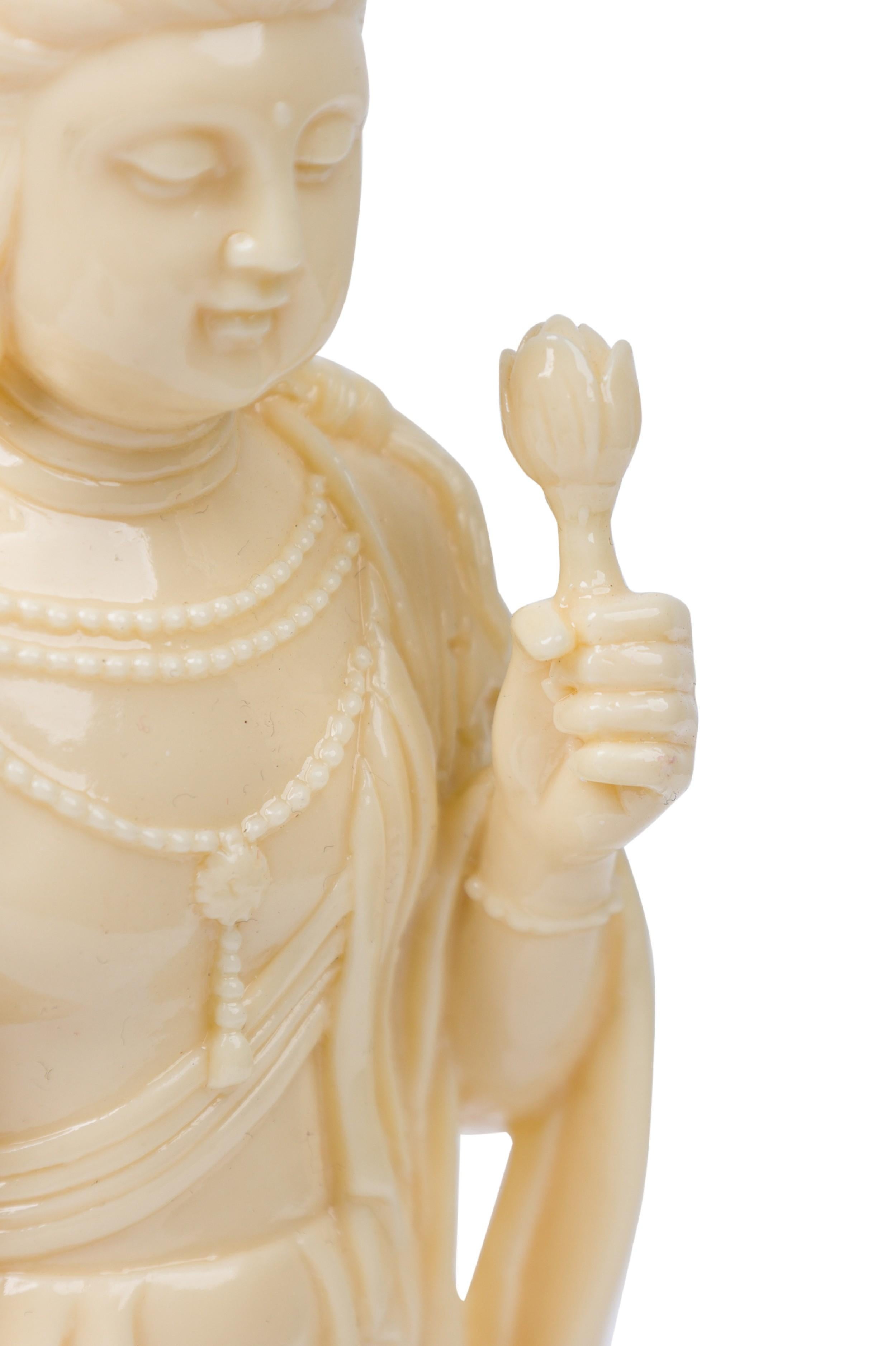 PAIR of Similar Chinese beige plastic robed, beaded figurine depicting the Buddhist Goddess with left arm raised, grasping a lotus, right arm relaxed with open palm. (PRICED AS PAIR)
 

 Broken left hand on one figure
