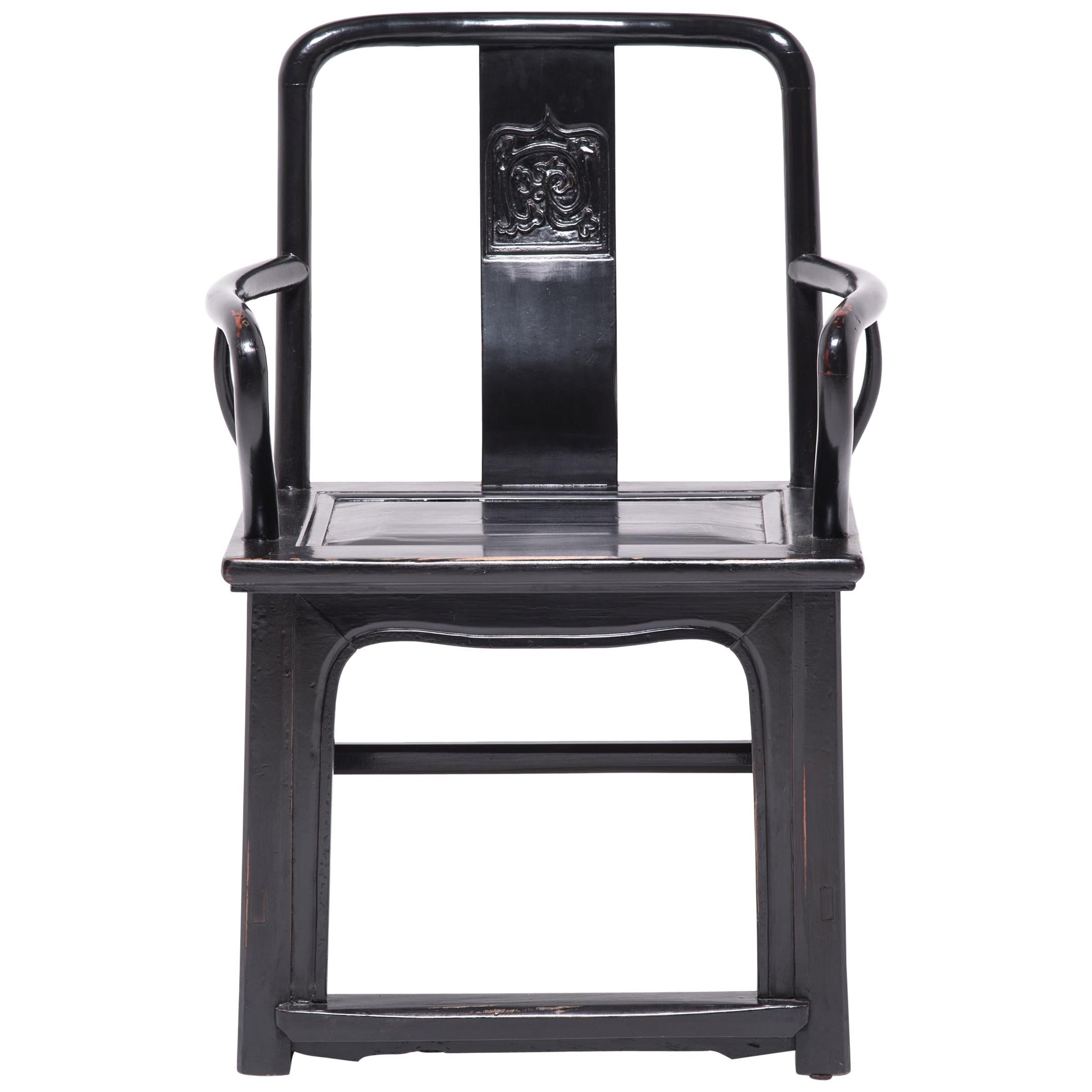 With strong lines and an upright stature, this imposing piece of furniture was the chair of choice for a 19th century administrator in northern China. Made of northern elmwood, these chairs have an elegant yet minimalist design, with sinuous lines