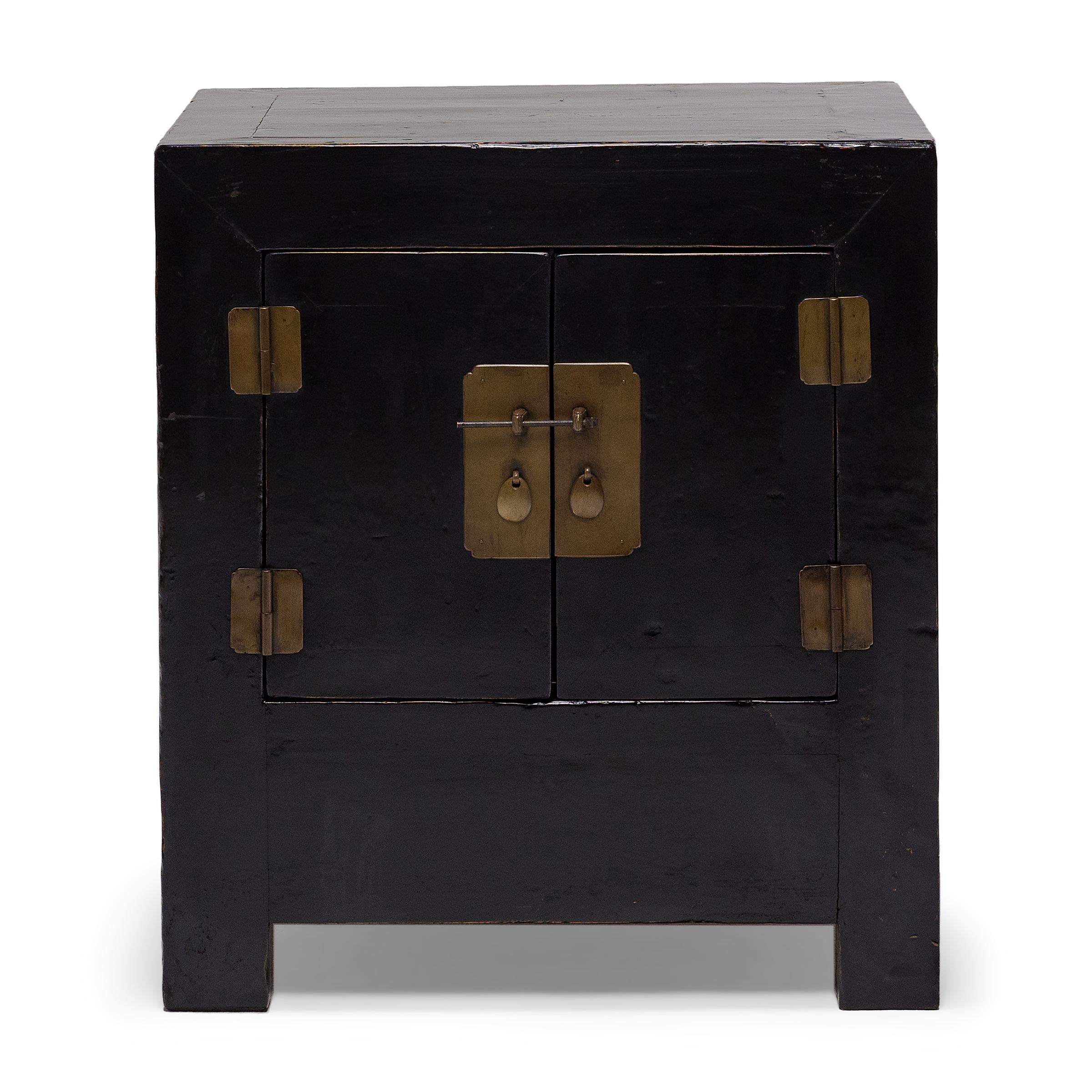 Perfecting line and proportion, the simple design of these small locking chests celebrates the restraint of classic Chinese furniture forms. Crafted of elm (yumu) using mortise-and-tenon joinery, the square-corner cabinets are configured with two