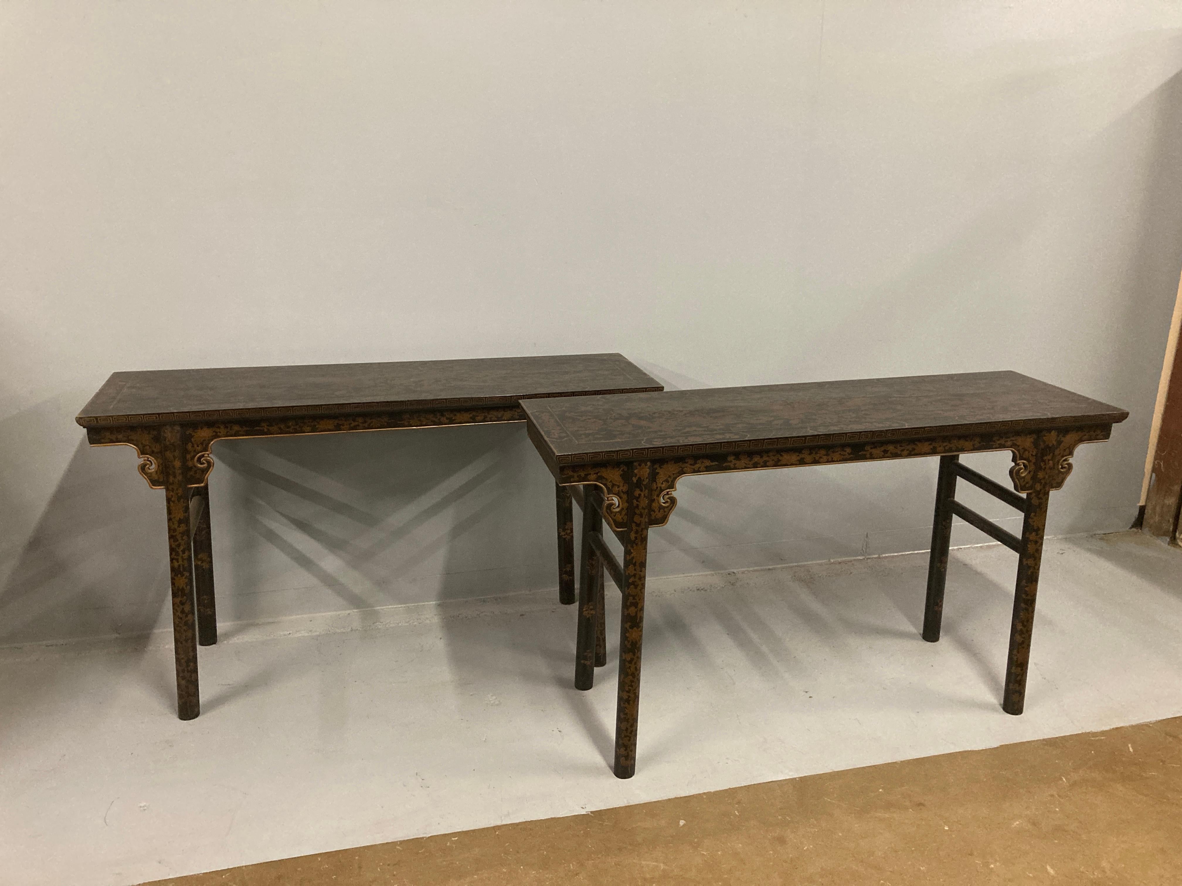 A pair of Chinese Qing style black lacquer console tables with gilded decoration depicting birds and foliage.
These tables are good examples of Qing Dynasty style made in the 1960s.