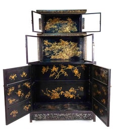 Pair of 20th Century Chinese Black and Gold Lacquered Three-Tiered Cabinets