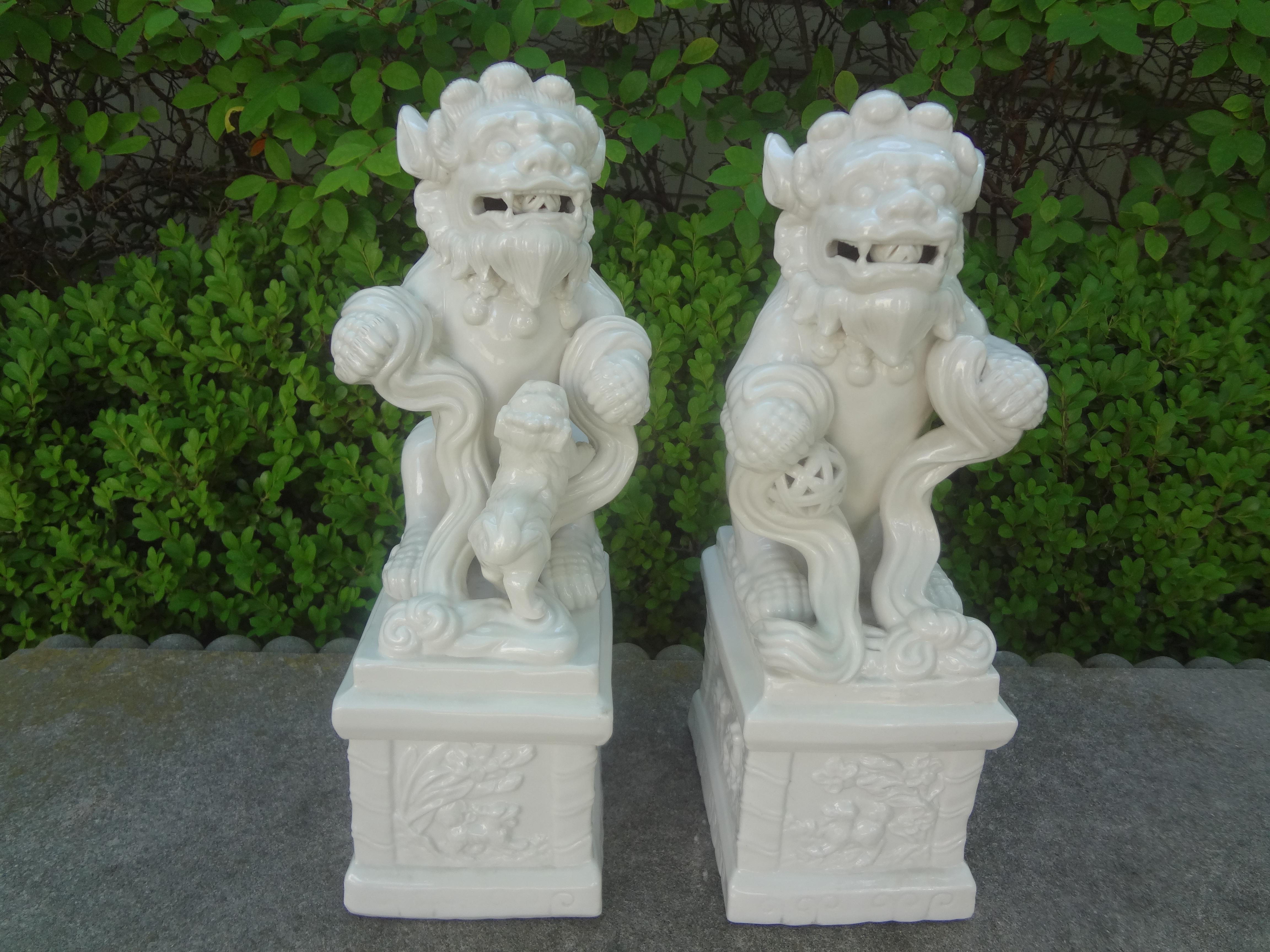 Pair of Chinese Blanc De Chine Foo dogs. This beautifully detailed pair of mid-20th century glazed ceramic foo dogs or foo lions are a male and female. The male figure being slightly larger than the female.
Dimensions:
Male:
14 inches H
5.25