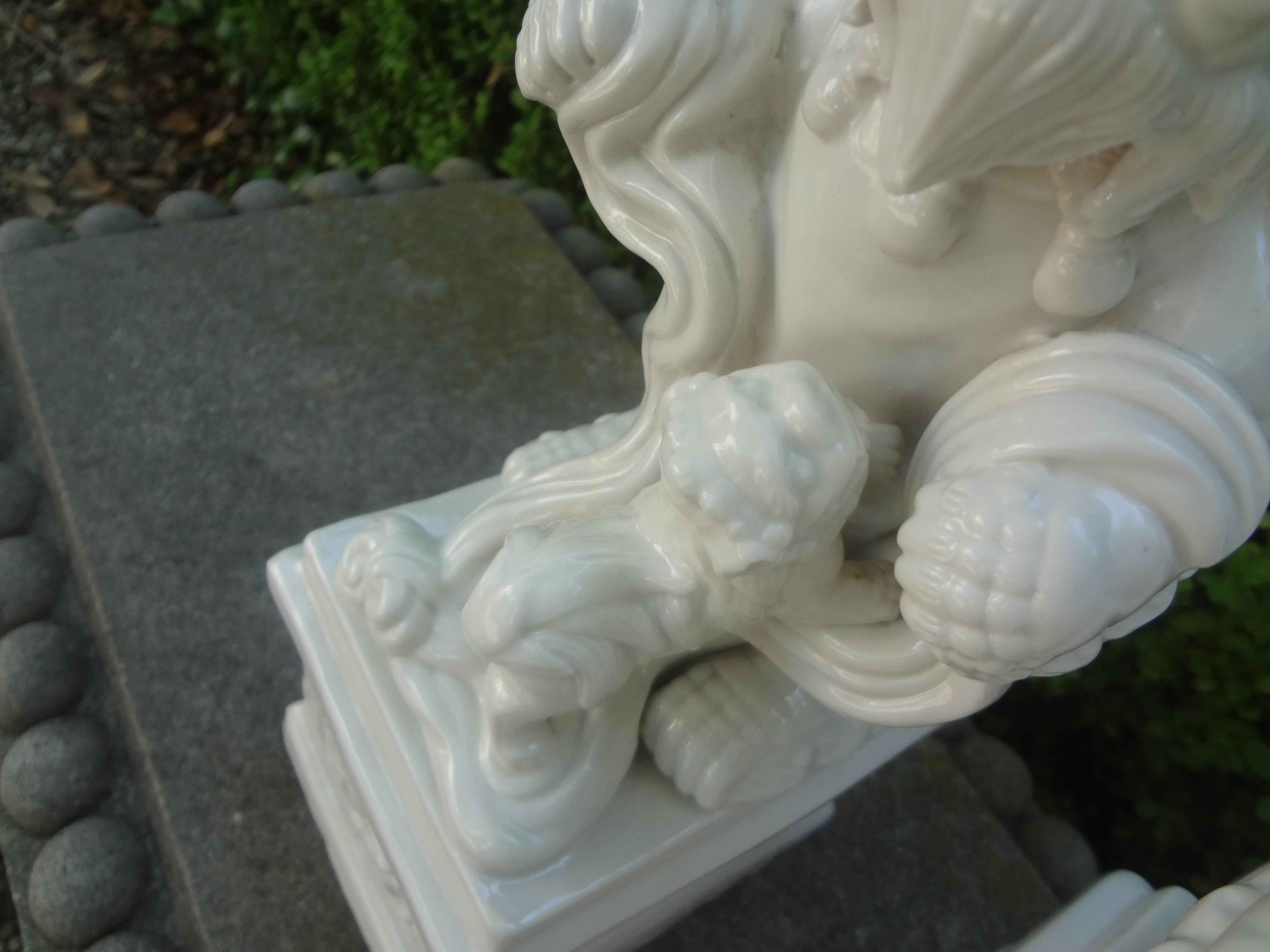 Mid-20th Century Pair of Chinese Blanc De Chine Foo Dogs