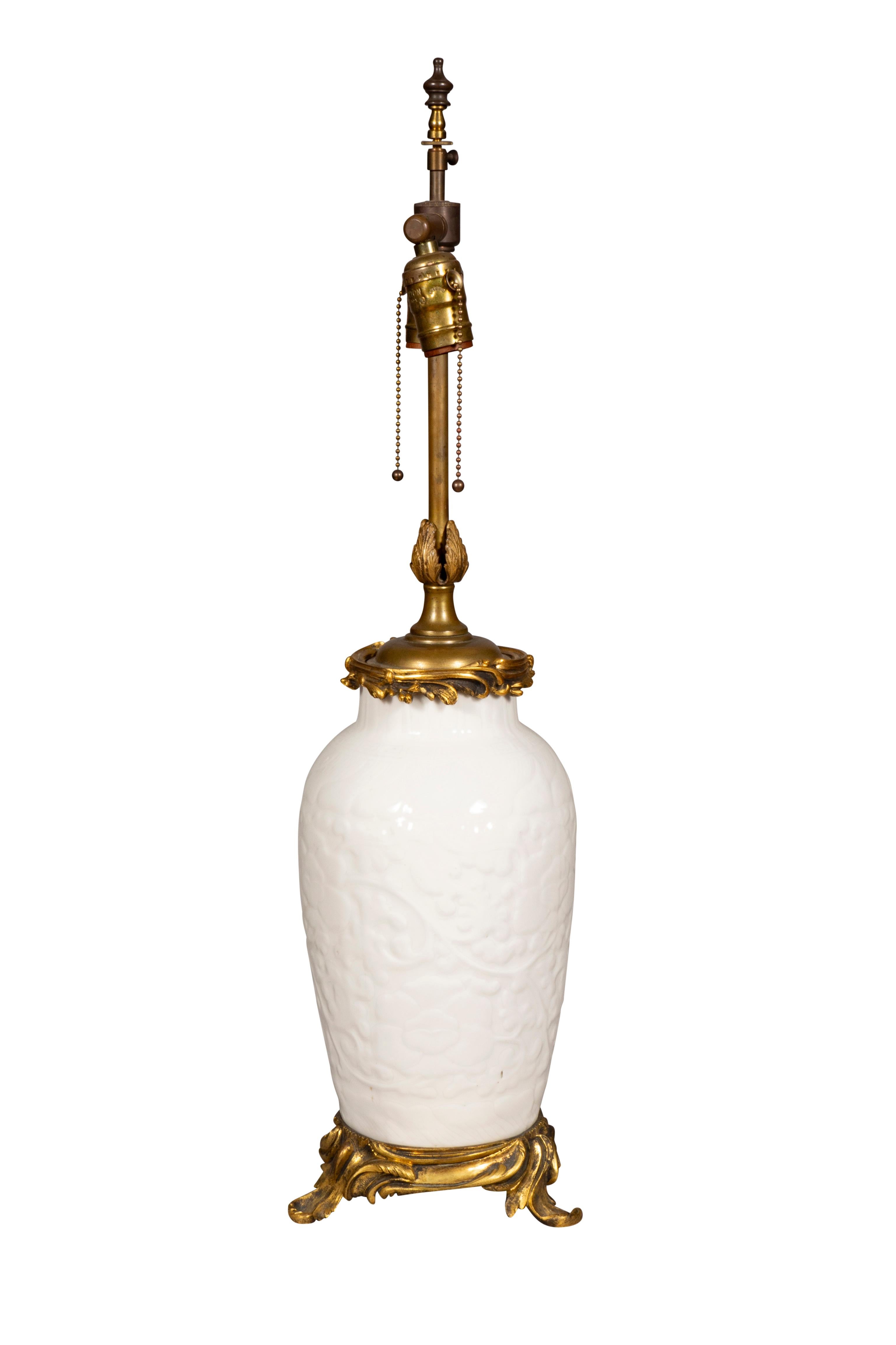 Pair Of Chinese Blanc De Chine Porcelain Ormolu Mounted Table Lamps In Good Condition In Essex, MA
