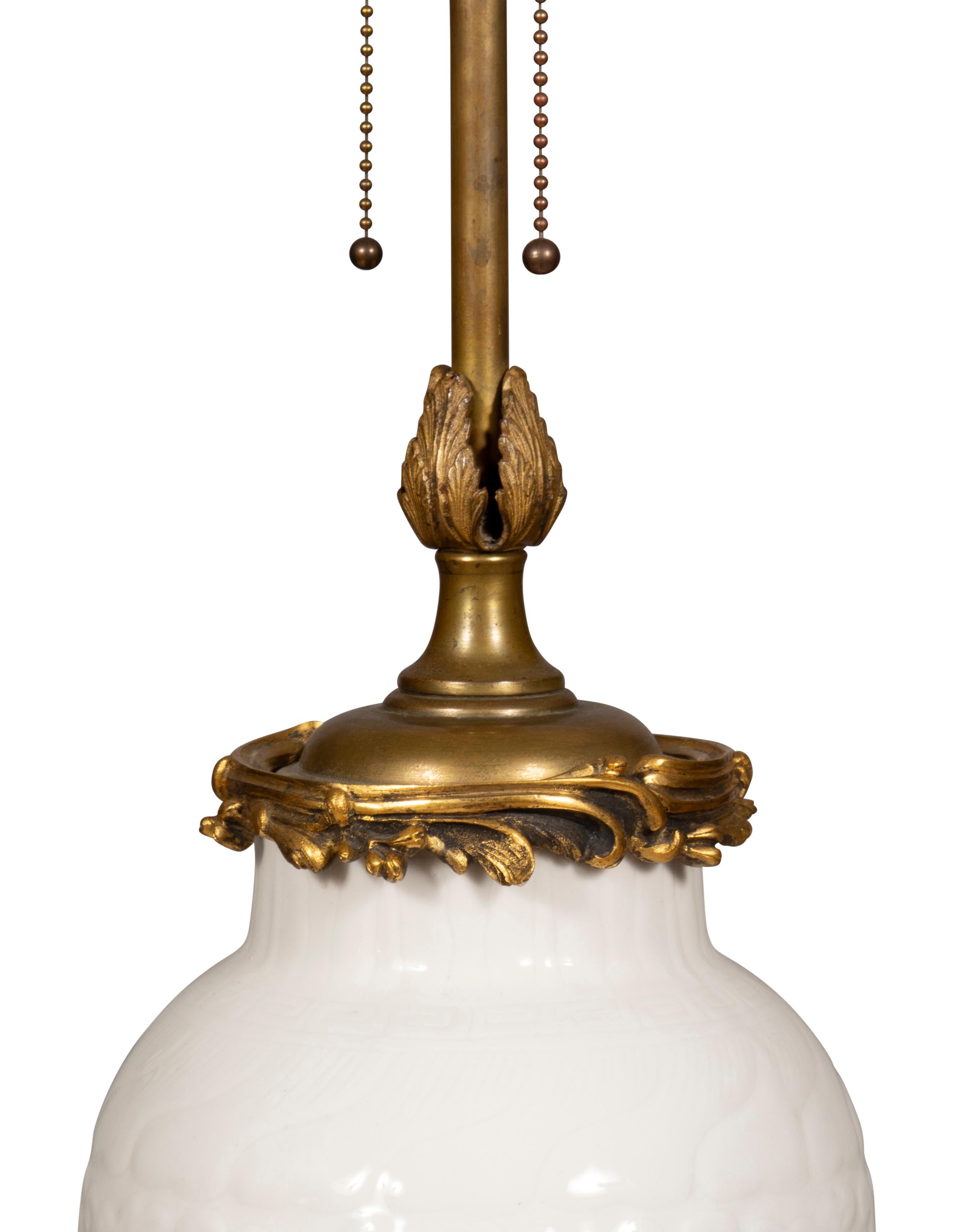 19th Century Pair Of Chinese Blanc De Chine Porcelain Ormolu Mounted Table Lamps