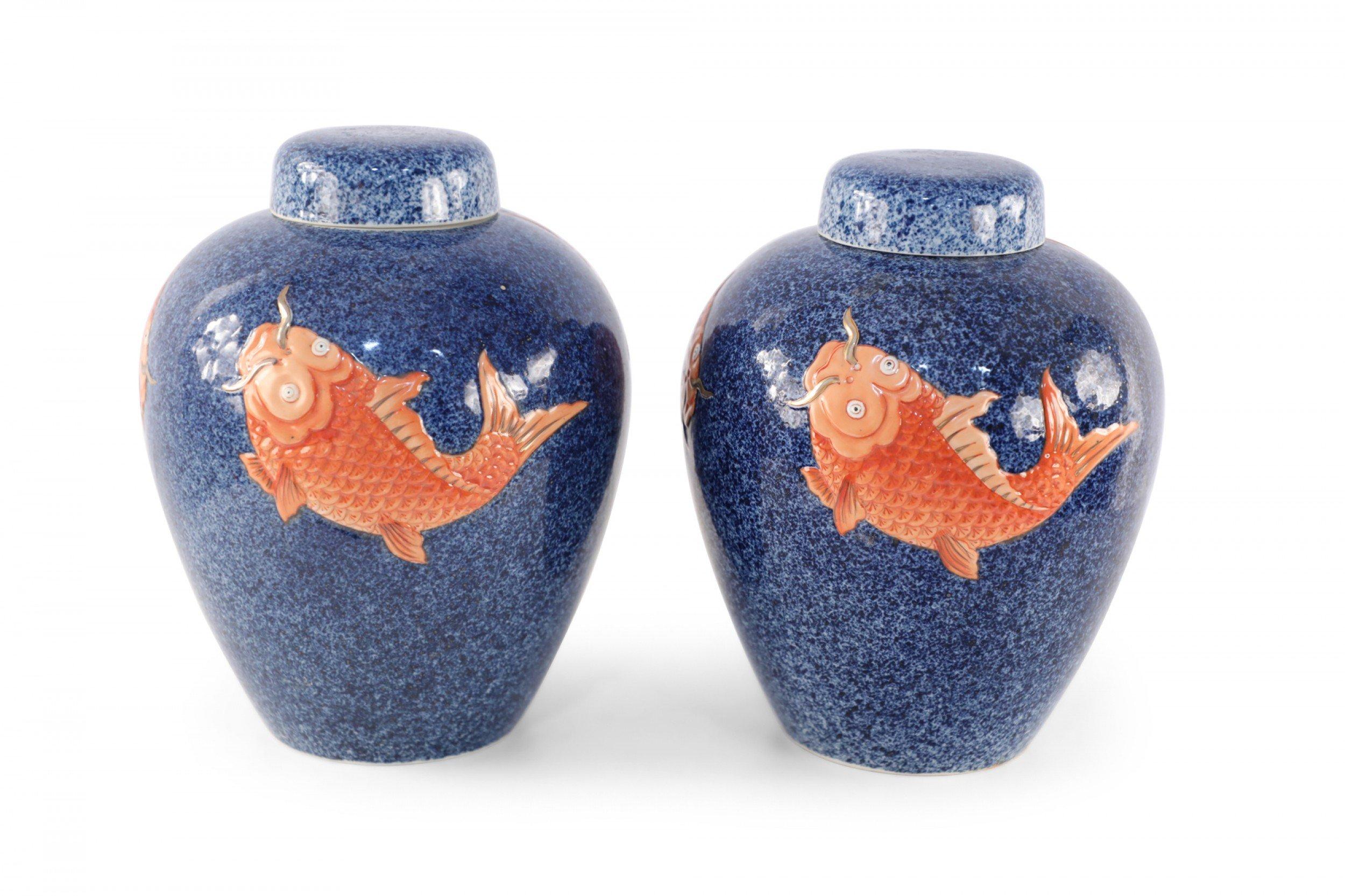Pair of Chinese Blue and Orange Fish Design Lidded Porcelain Jars In Good Condition For Sale In New York, NY
