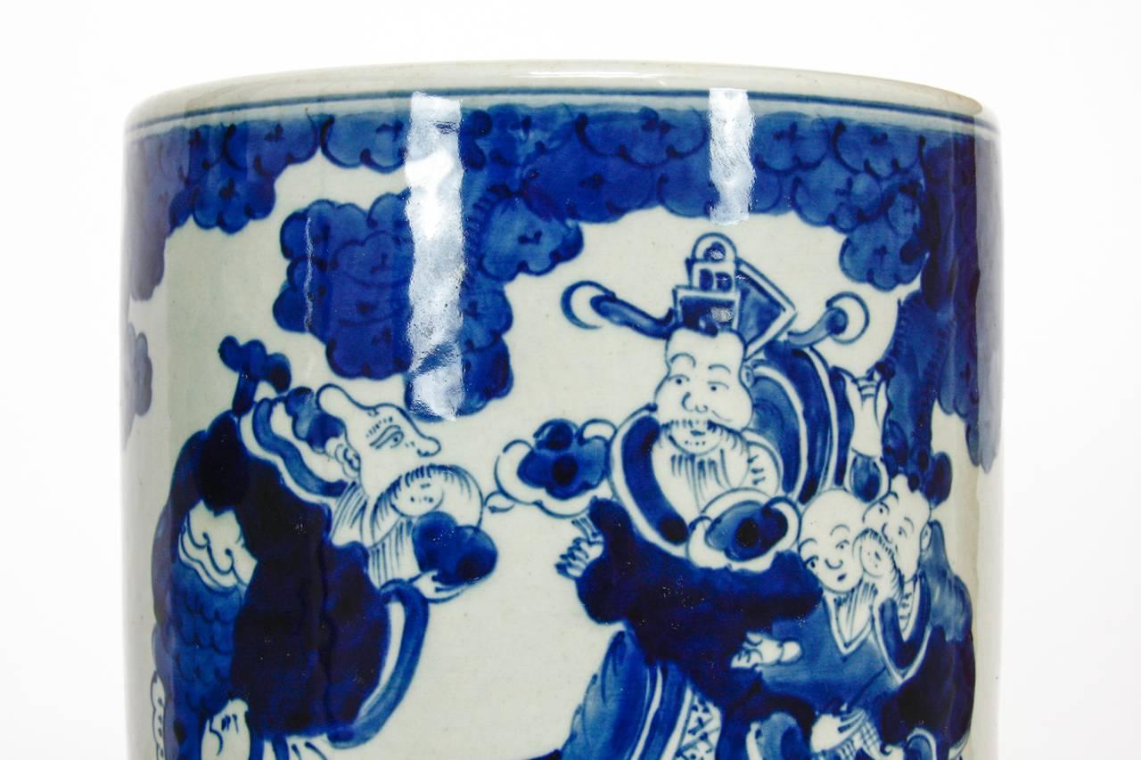 Charming pair of Chinese Republic perod blue and white ceramic brush pots or cachepots. Beautifully decorated with people, animals, and pottery. Slightly varying in size both having Kangxi period concentric circles on the bottom, but probably