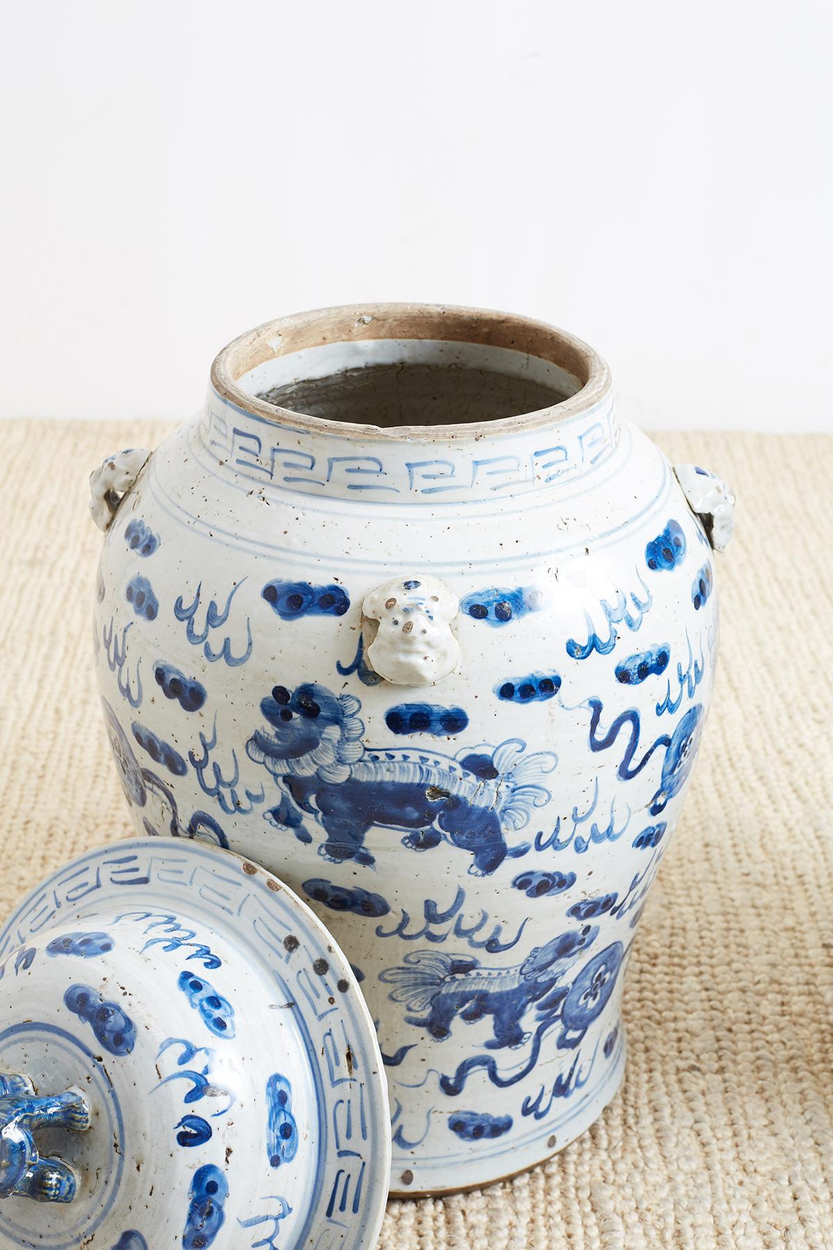 Ceramic Pair of Chinese Blue and White Ginger Jars with Foo Dogs