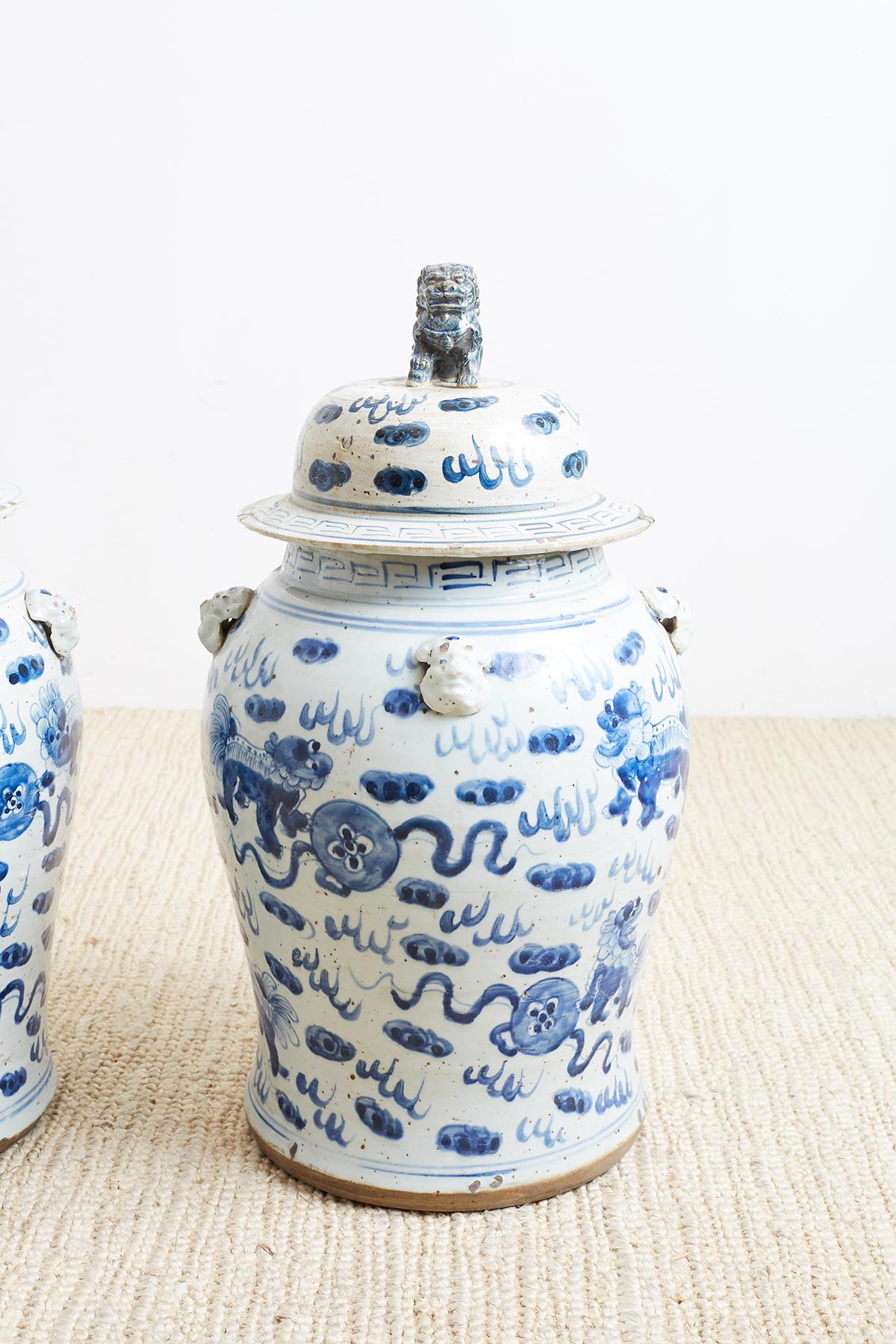 Chinese Export Pair of Chinese Blue and White Ginger Jars with Foo Dogs