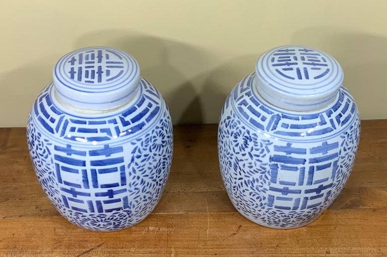 Pair of Chinese blue and white porcelain ginger jar, hand painted all-over stylized foliate decoration with central double happy symbol, 20th century, beautiful object of art for display.