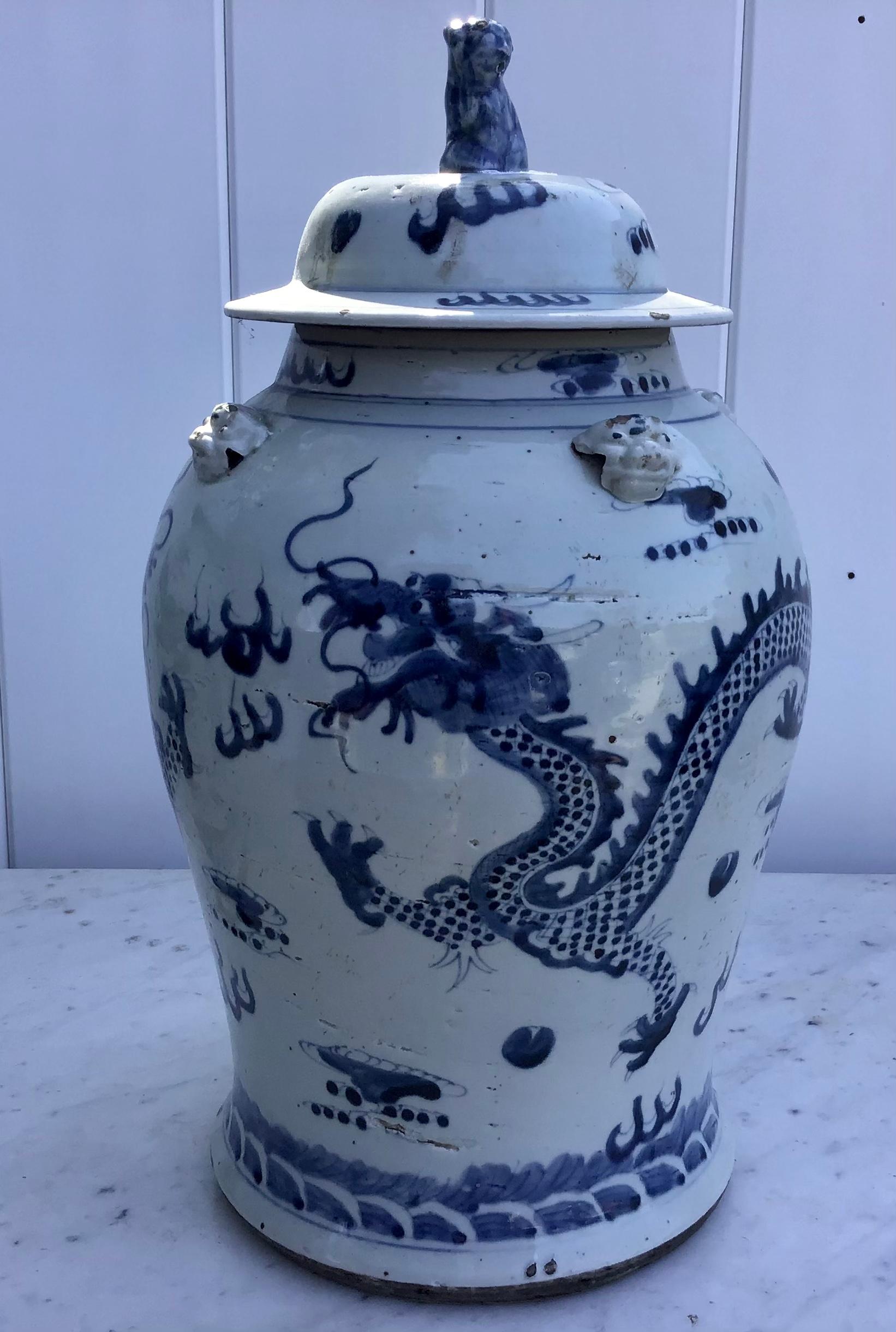 Pair of Chinese blue and white vases with lids.