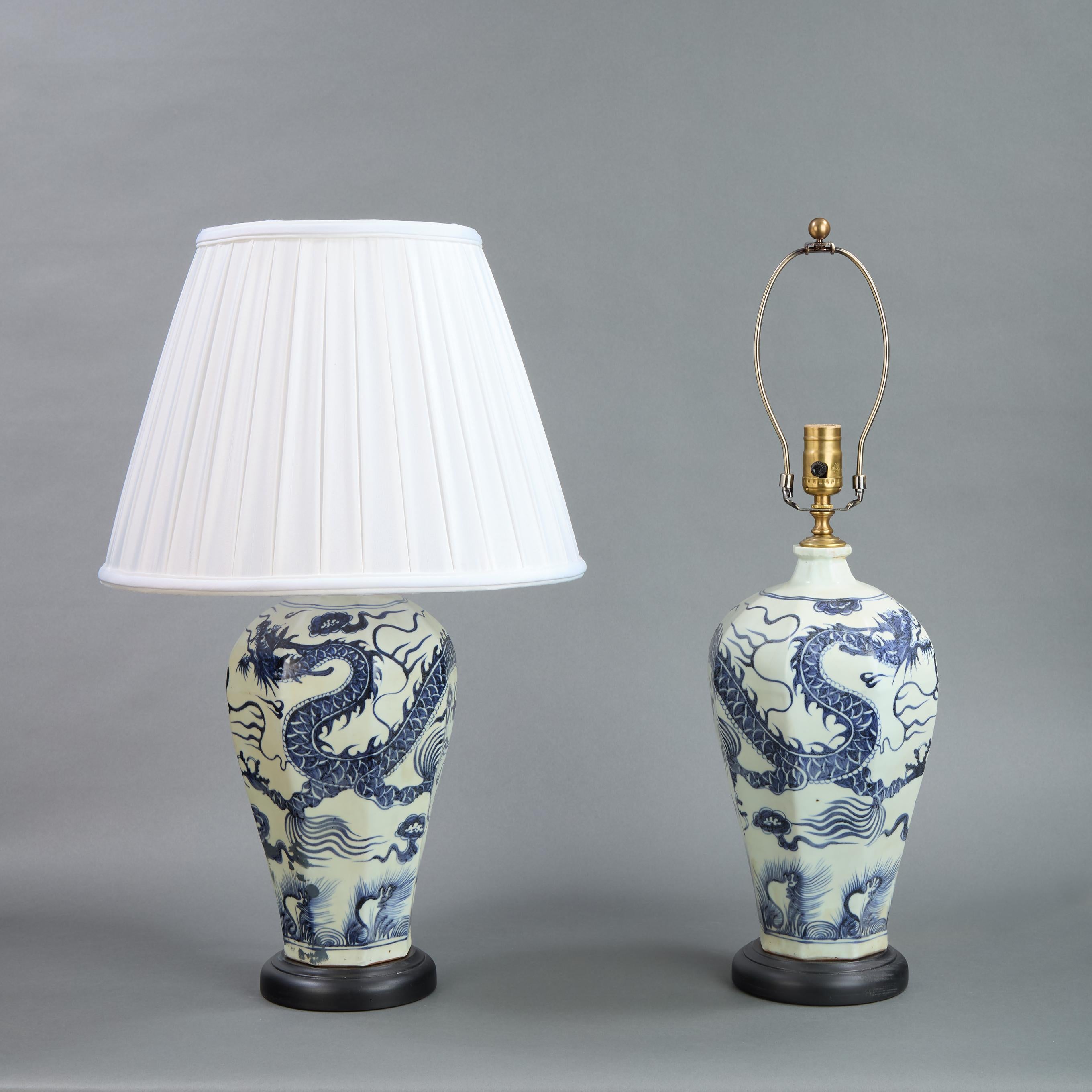 Pair of Chinese blue and white lamps with dragon motif. 20th Century.
8