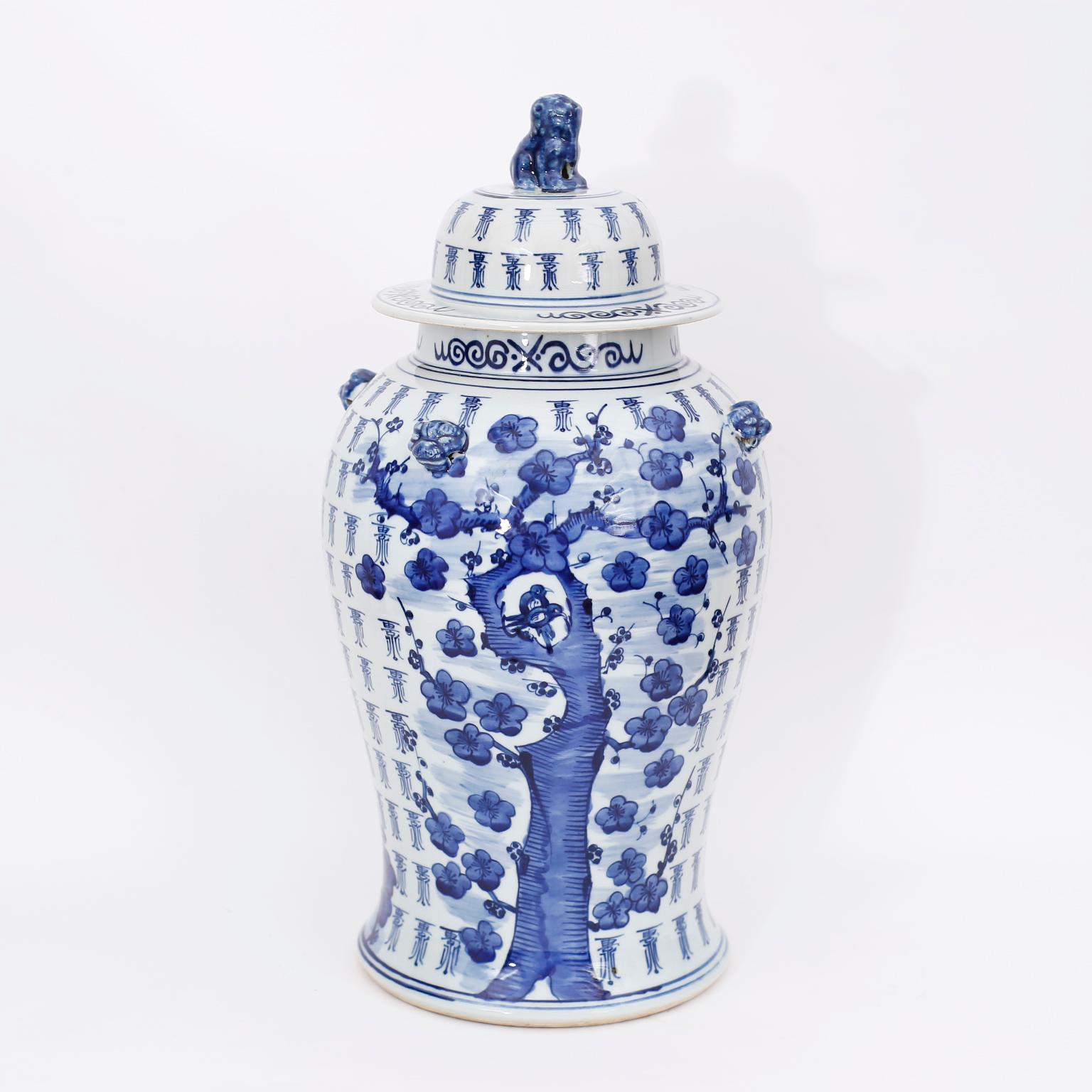 Pair of Chinese Blue and White Porcelain Cherry Blossom Lidded Jars In Good Condition In Palm Beach, FL