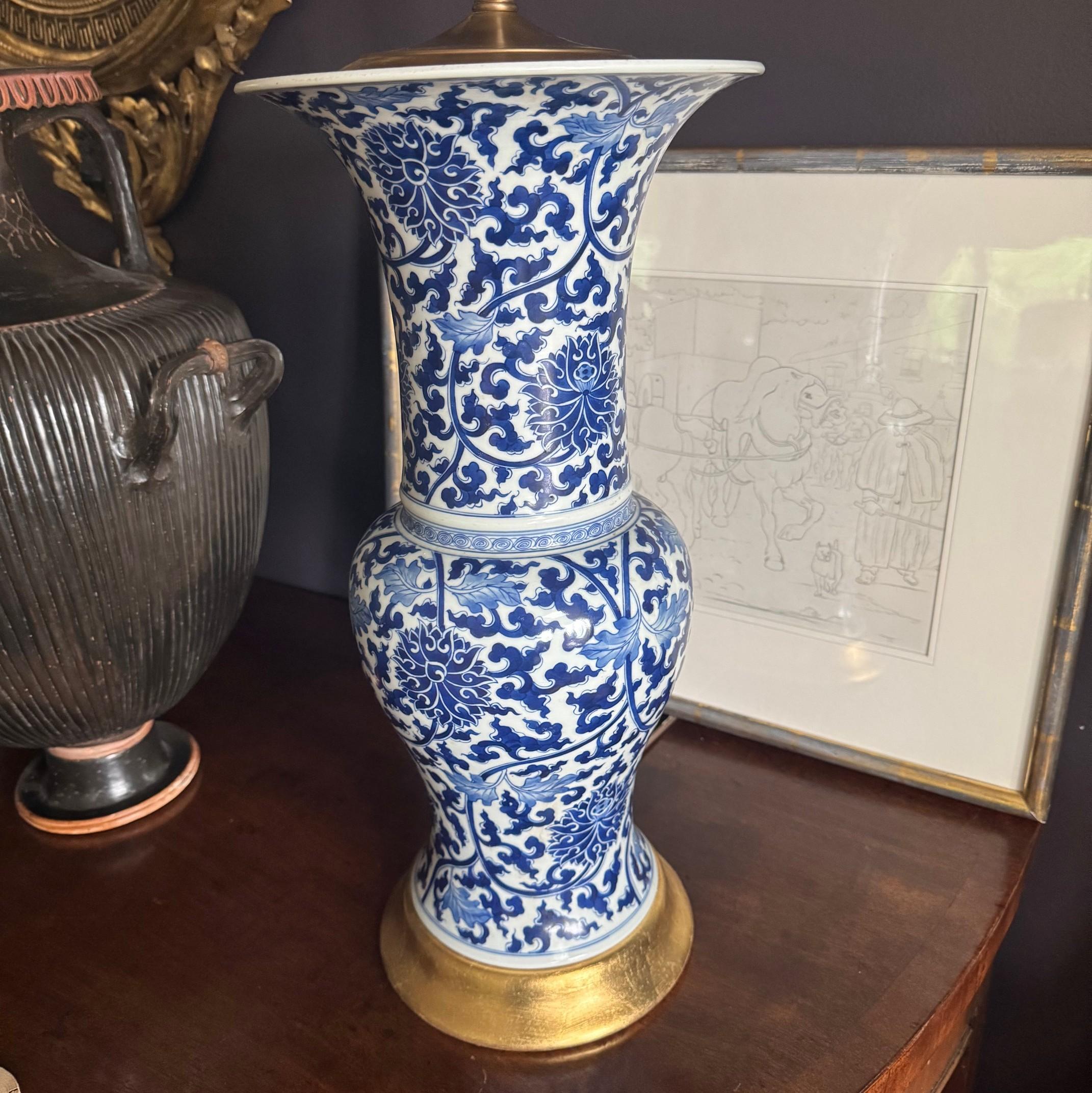 Cast Pair of Chinese Blue and White Porcelain Fish Tail Lamps on Gilt Bases. For Sale
