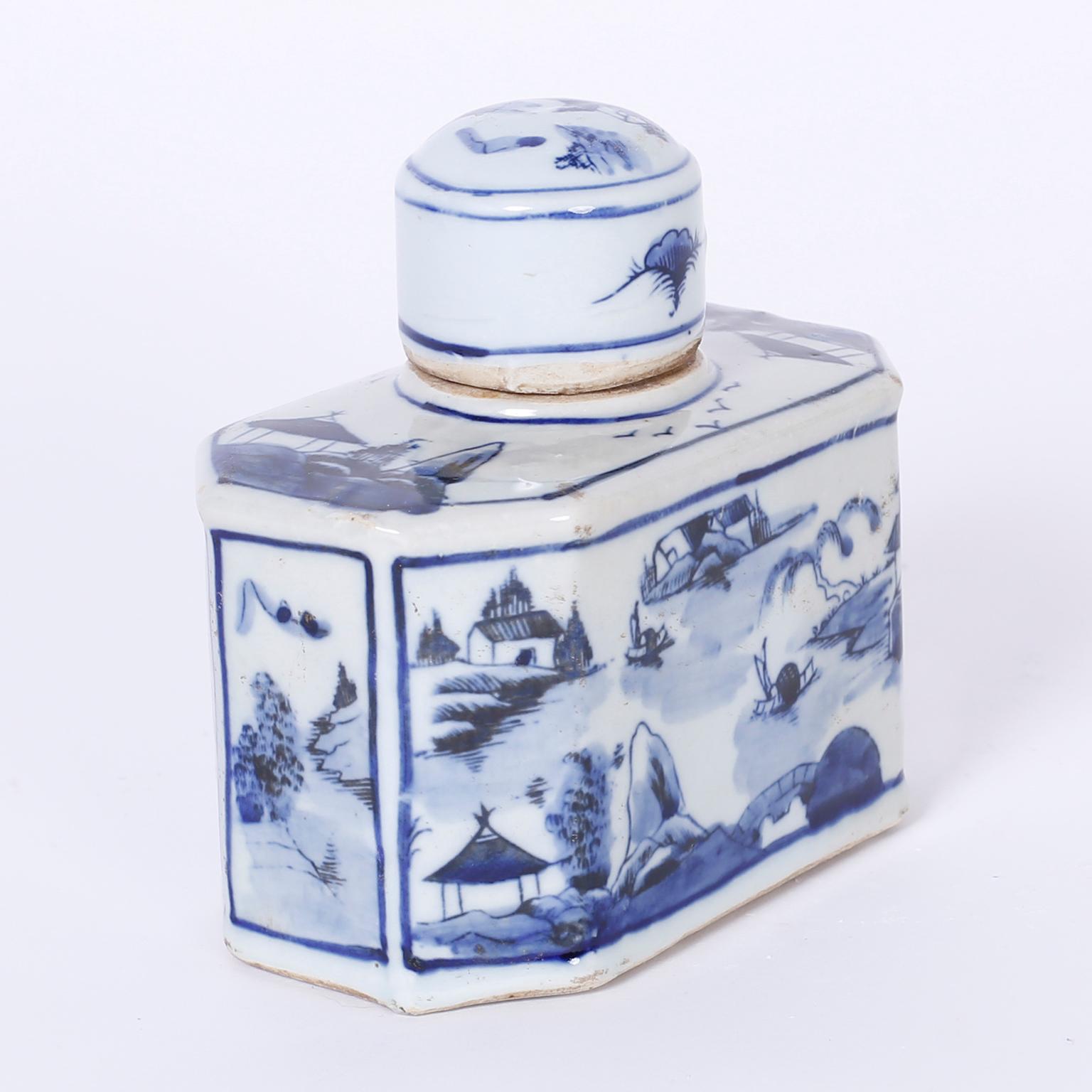 Intriguing pair of Chinese porcelain blue and white porcelain jars or bottles having an uncommon hexagon form, small fitted lids and decorated all around with Classic symbolic chinoiserie landscapes.