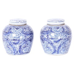 Pair of Chinese Blue and White Porcelain Lidded Jars with Flowers and Leaves