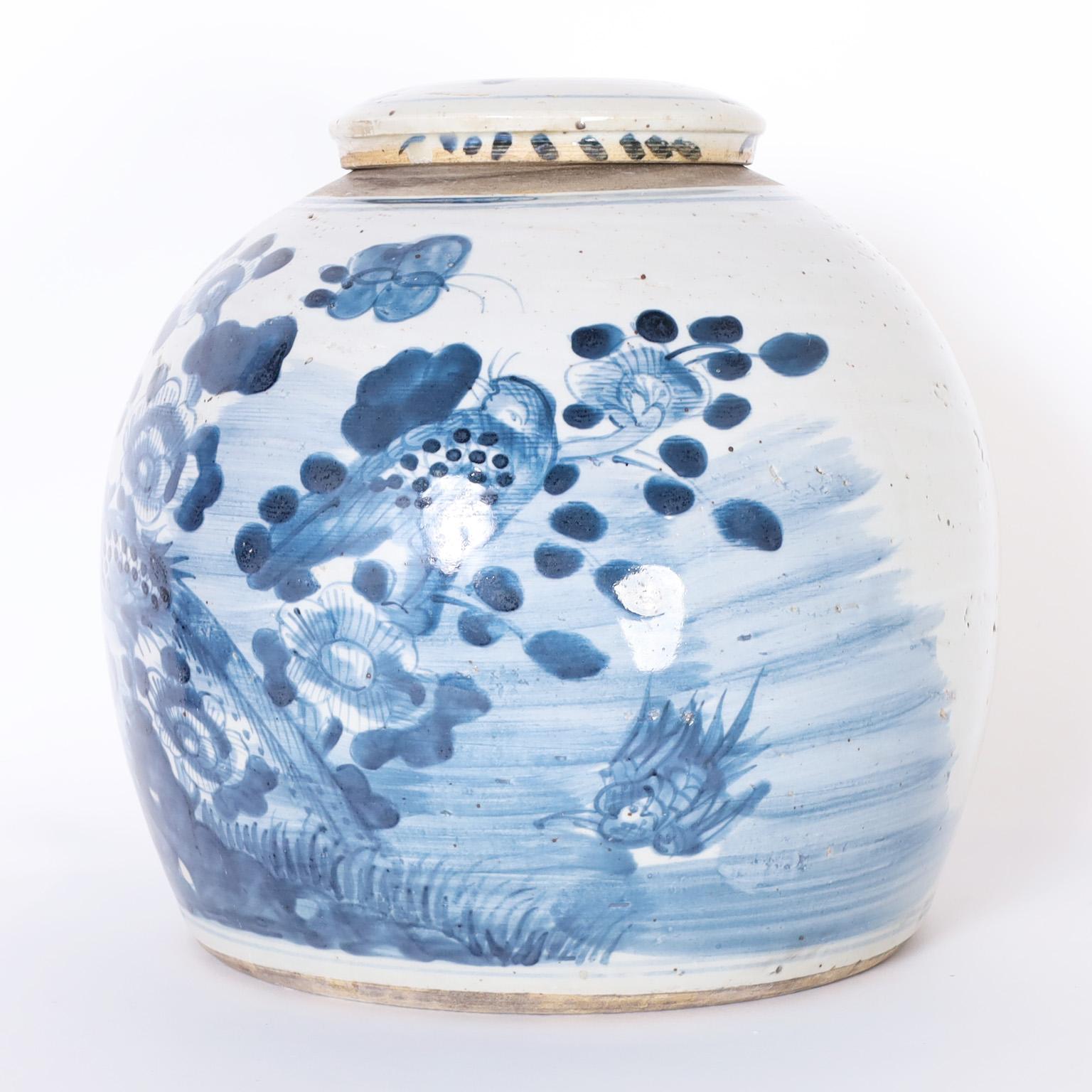 Glazed Pair of Chinese Blue and White Porcelain Lidded Jars with Pheonix Birds
